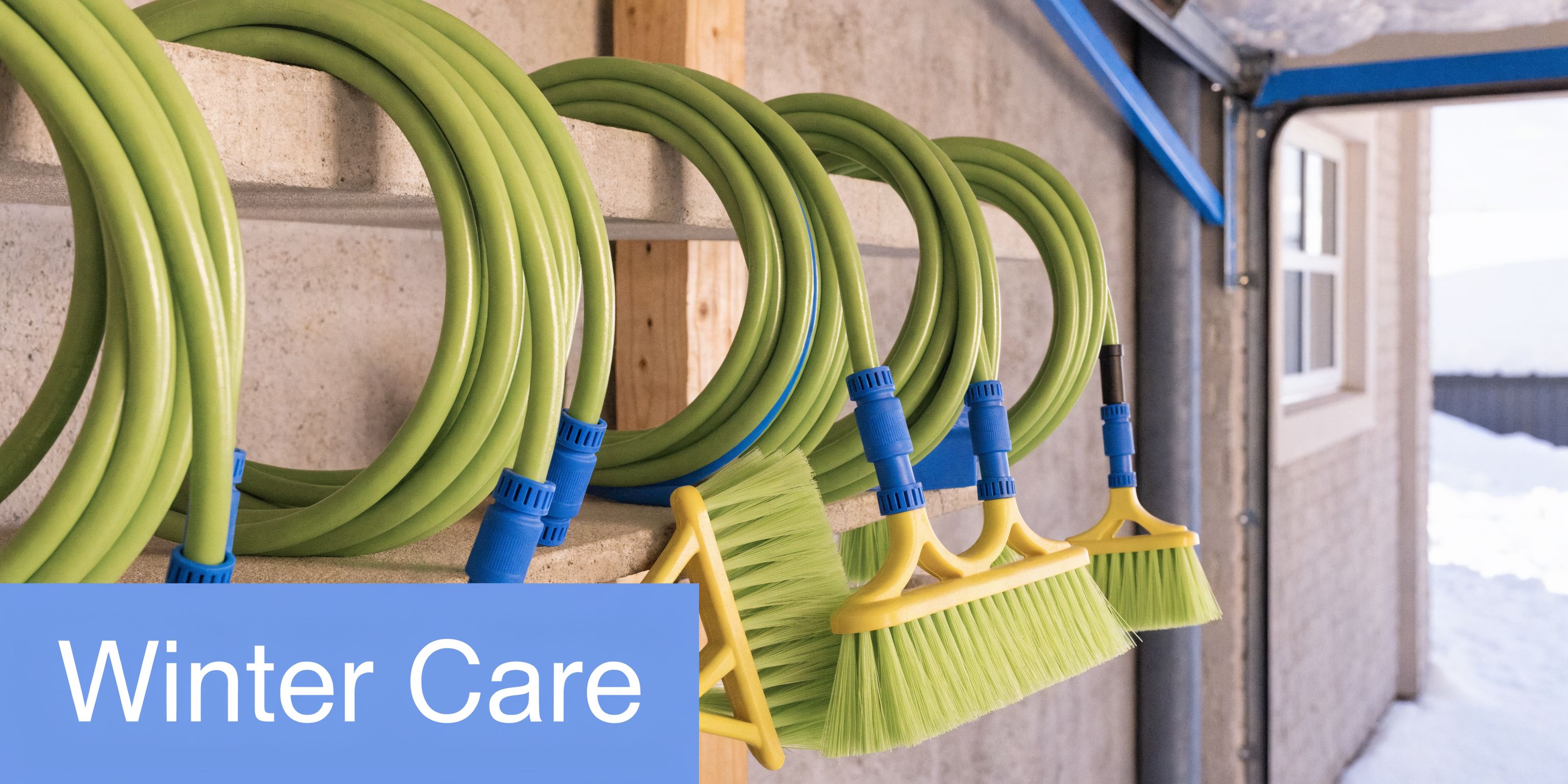 A collection of green hoses with yellow window washing brush attachments stored neatly on a wooden wall shelf.