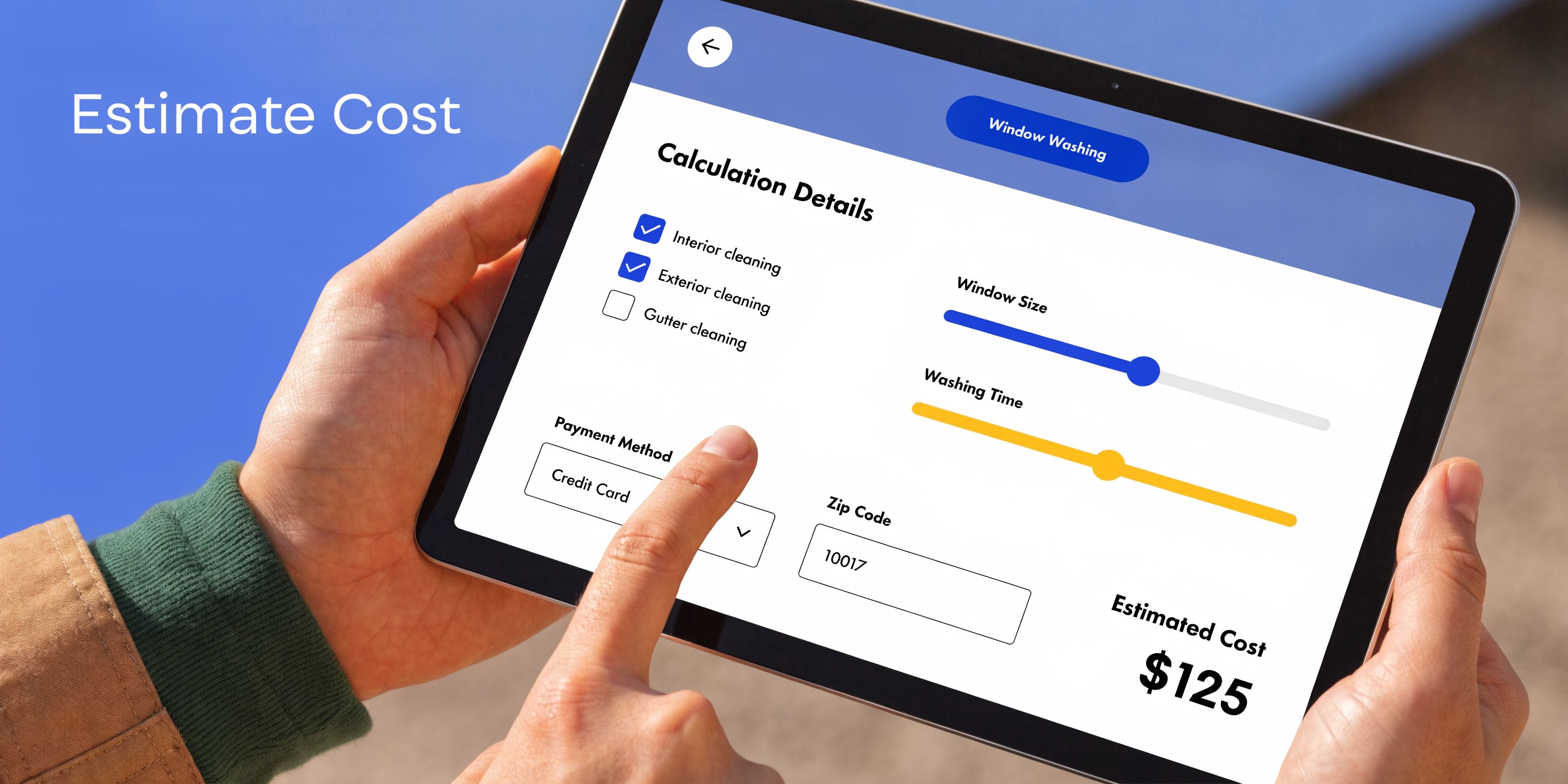 A person using a tablet to calculate the price of window washing services with a digital interface.