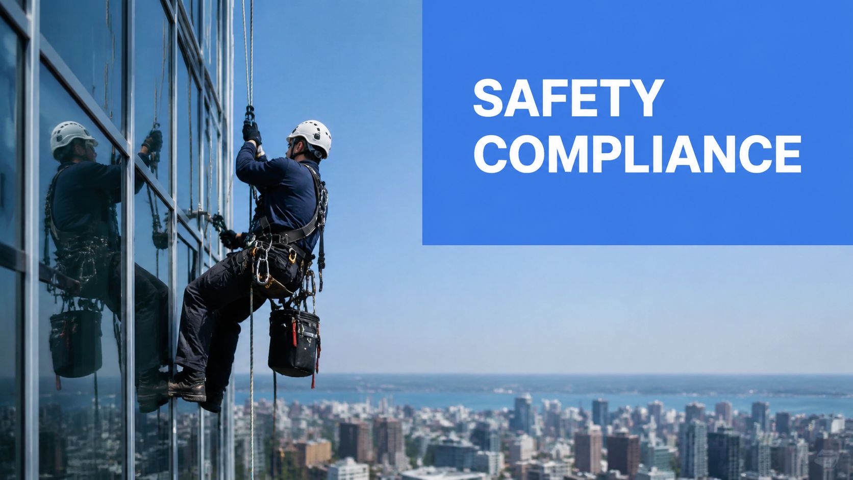 A professional industrial climber performs exterior building maintenance while suspended by ropes on a glass skyscraper.