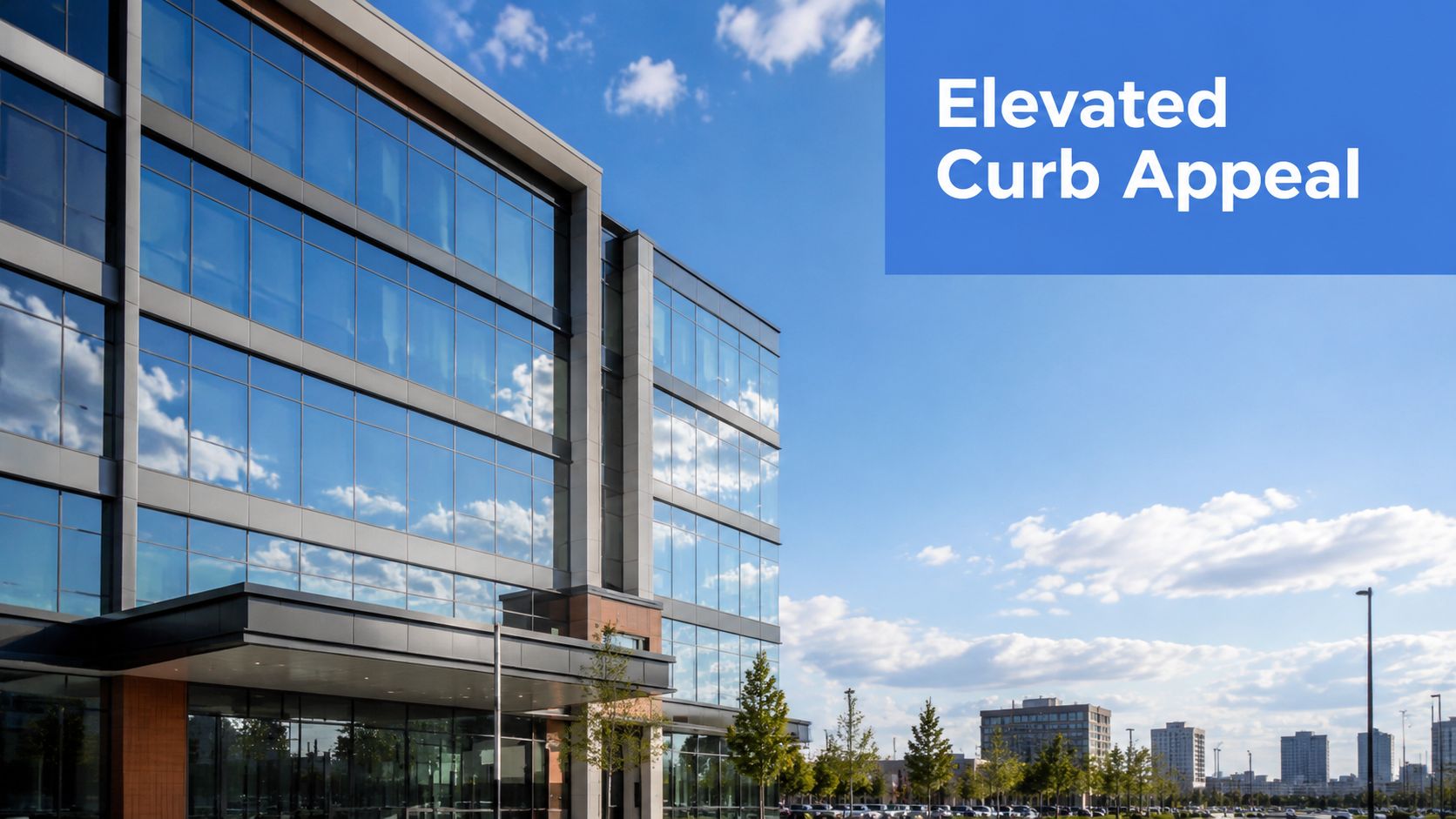 A sleek modern office building featuring glass windows reflecting the bright blue sky and clouds.