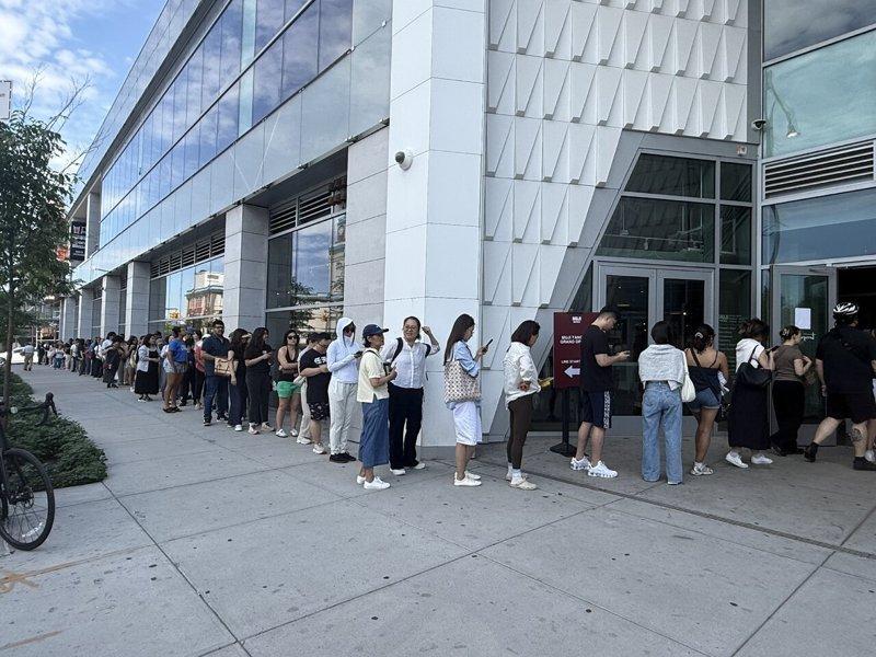 Around 10:55 a.m. that day, the line had stretched from the main entrance on College Point Avenue all the way to the corner of 37th Avenue, and then...