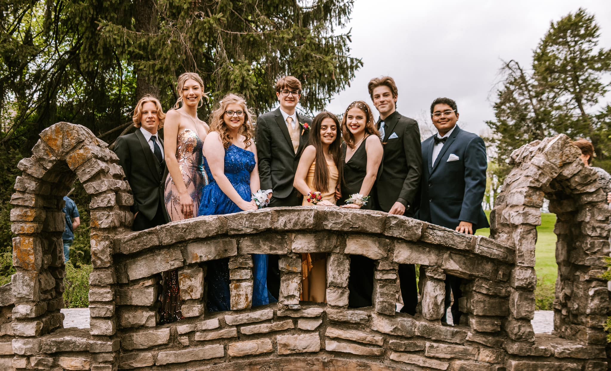 A group of students from a local high school pose for prom pictures.