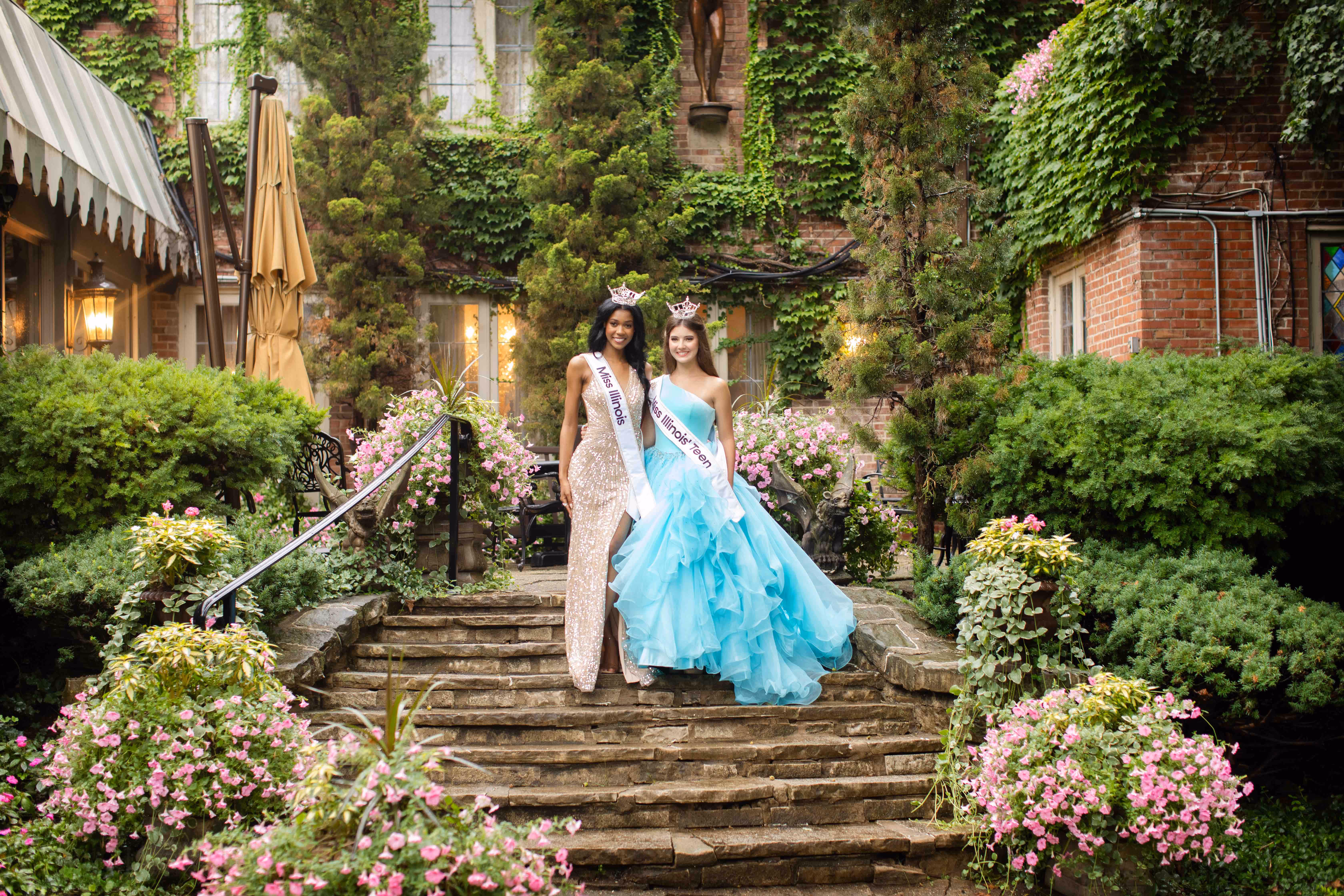 Miss Illinois 2025 poses with Miss Illinois Teen 2025 on the back patio steps of the Soderstrom Castle.
