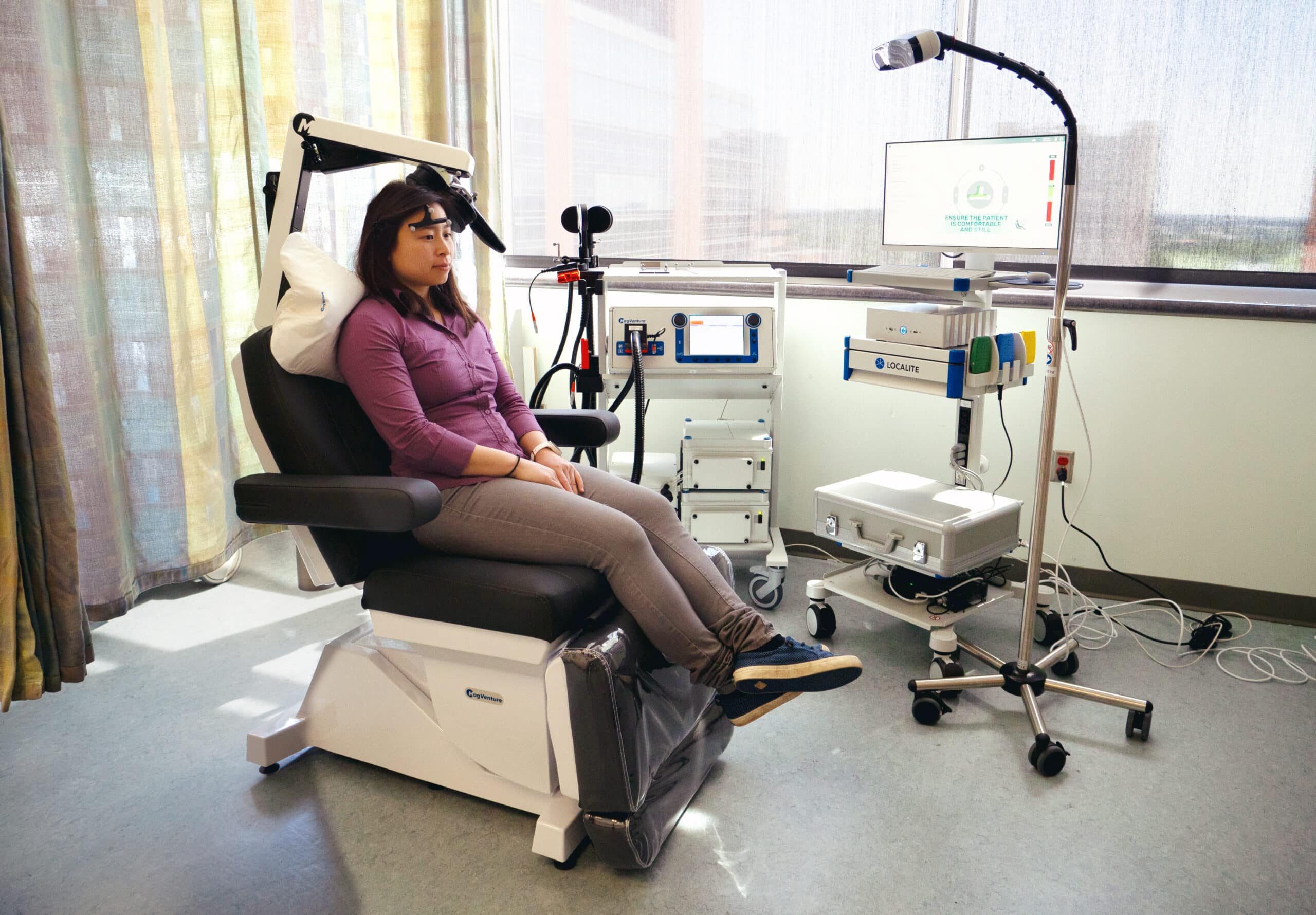 A person receiving TMS treatment as part of SAINT