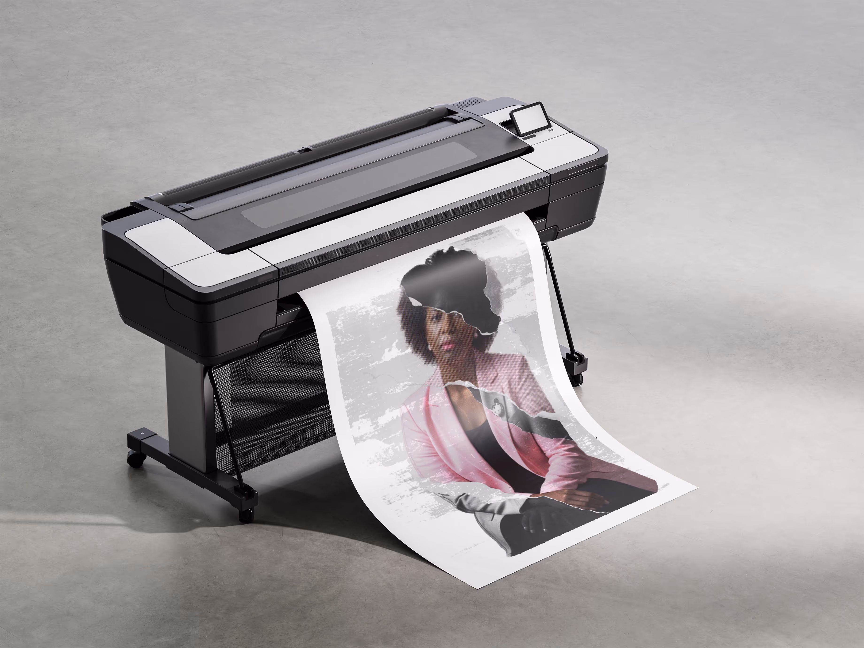 Large-format printer producing a high-resolution poster featuring a woman in a pink blazer with a serious expression, overlaid with a torn-paper visual effect. The printout lies partially on a smooth concrete floor, emphasizing professional print production, visual storytelling, and healthcare-related campaign design.