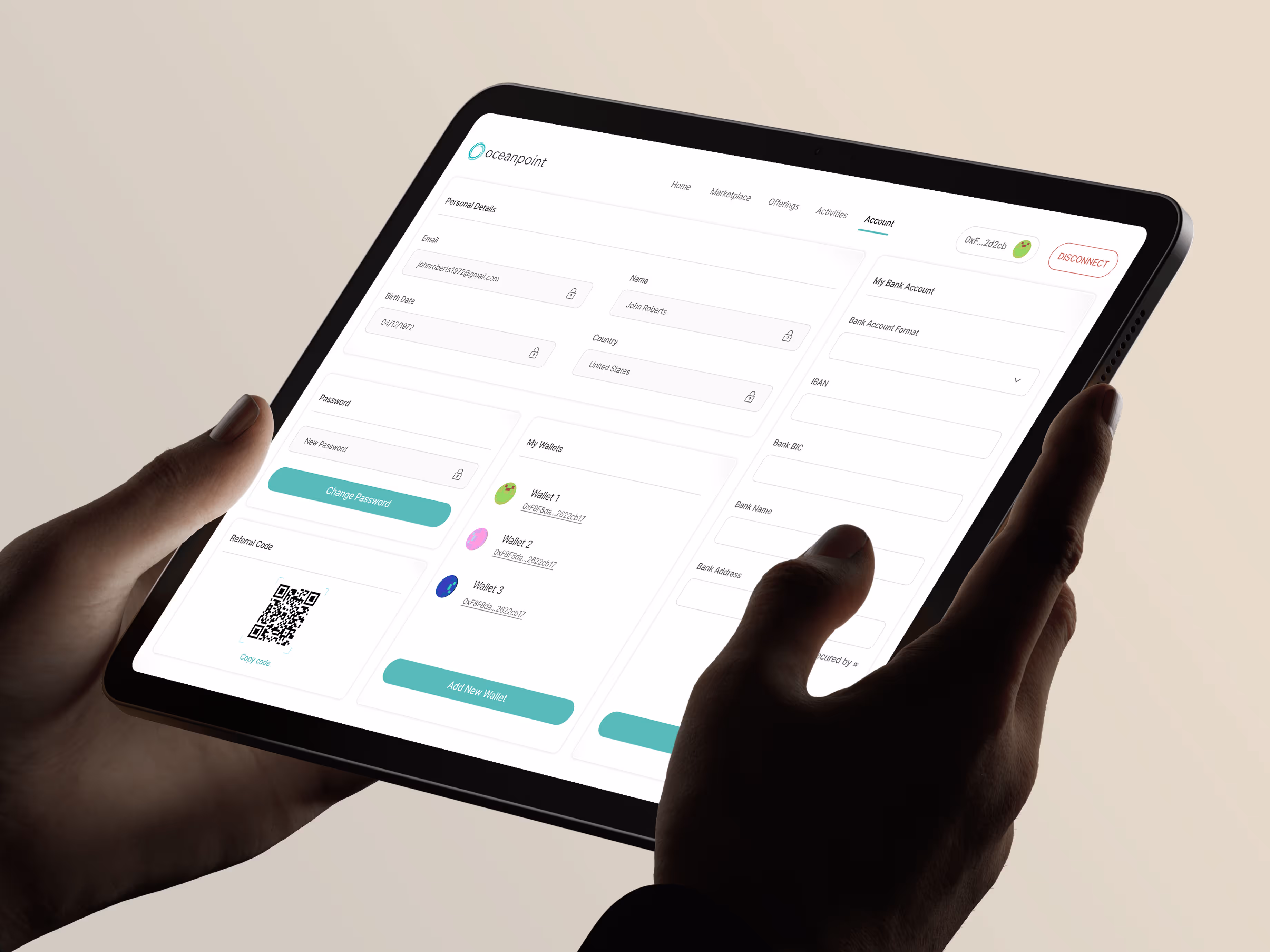 User holding a tablet displaying the Oceanpoint by Blocksquare account management dashboard. The interface includes editable fields for personal details, wallet management, bank account integration, and a referral code with QR scan functionality. Optimized for decentralized finance (DeFi) users managing tokenized real estate investments, multi-wallet connections, and secure identity verification.