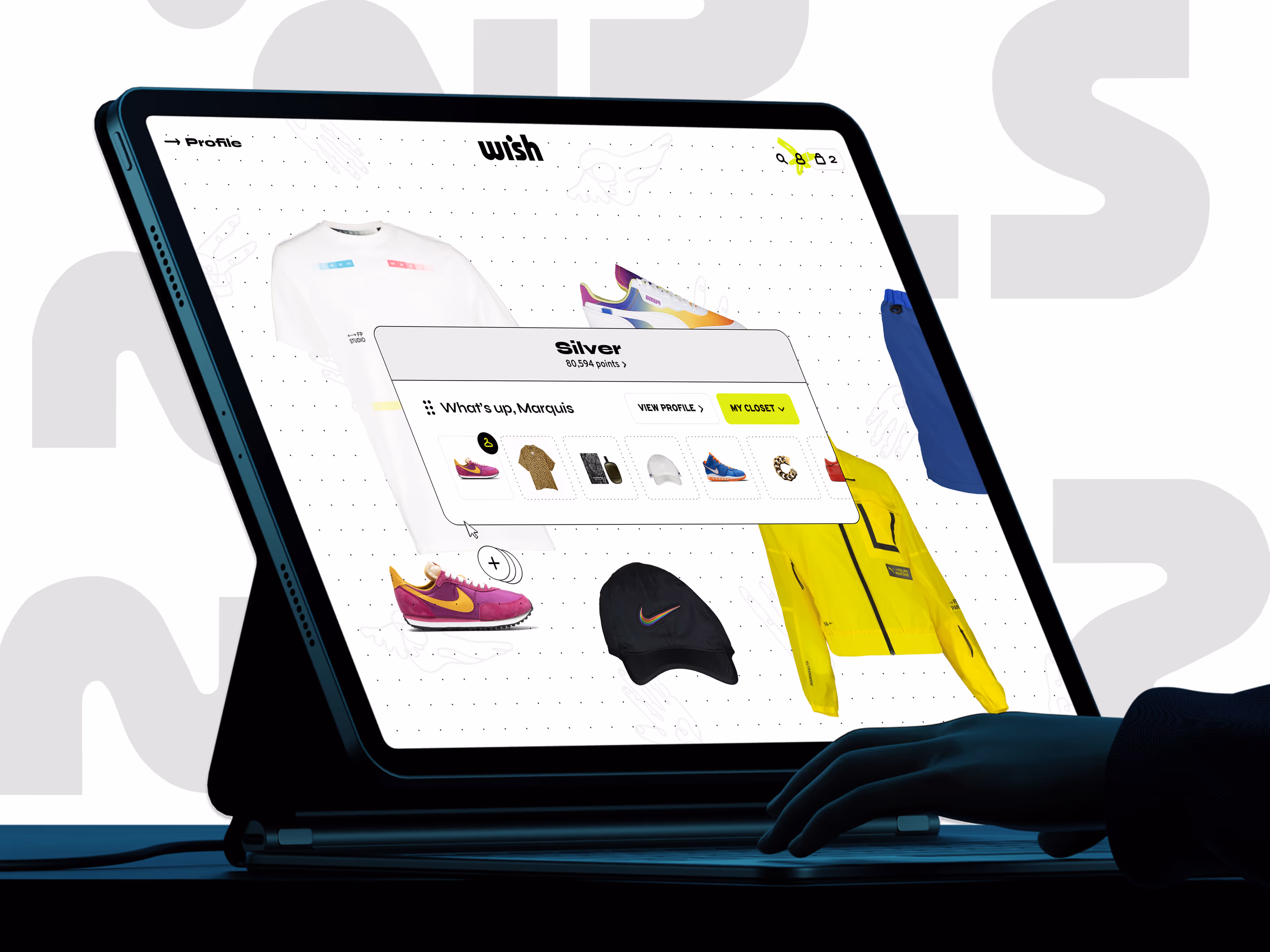 User interacting with Wish ATL’s digital storefront on a tablet, displaying a personalized shopping dashboard titled “My Closet.” The screen shows curated streetwear items including Nike sneakers, graphic tees, a yellow jacket, and accessories. Loyalty tier “Silver” is highlighted with point balance, offering a gamified e-commerce experience blending urban fashion and digital retail innovation.
