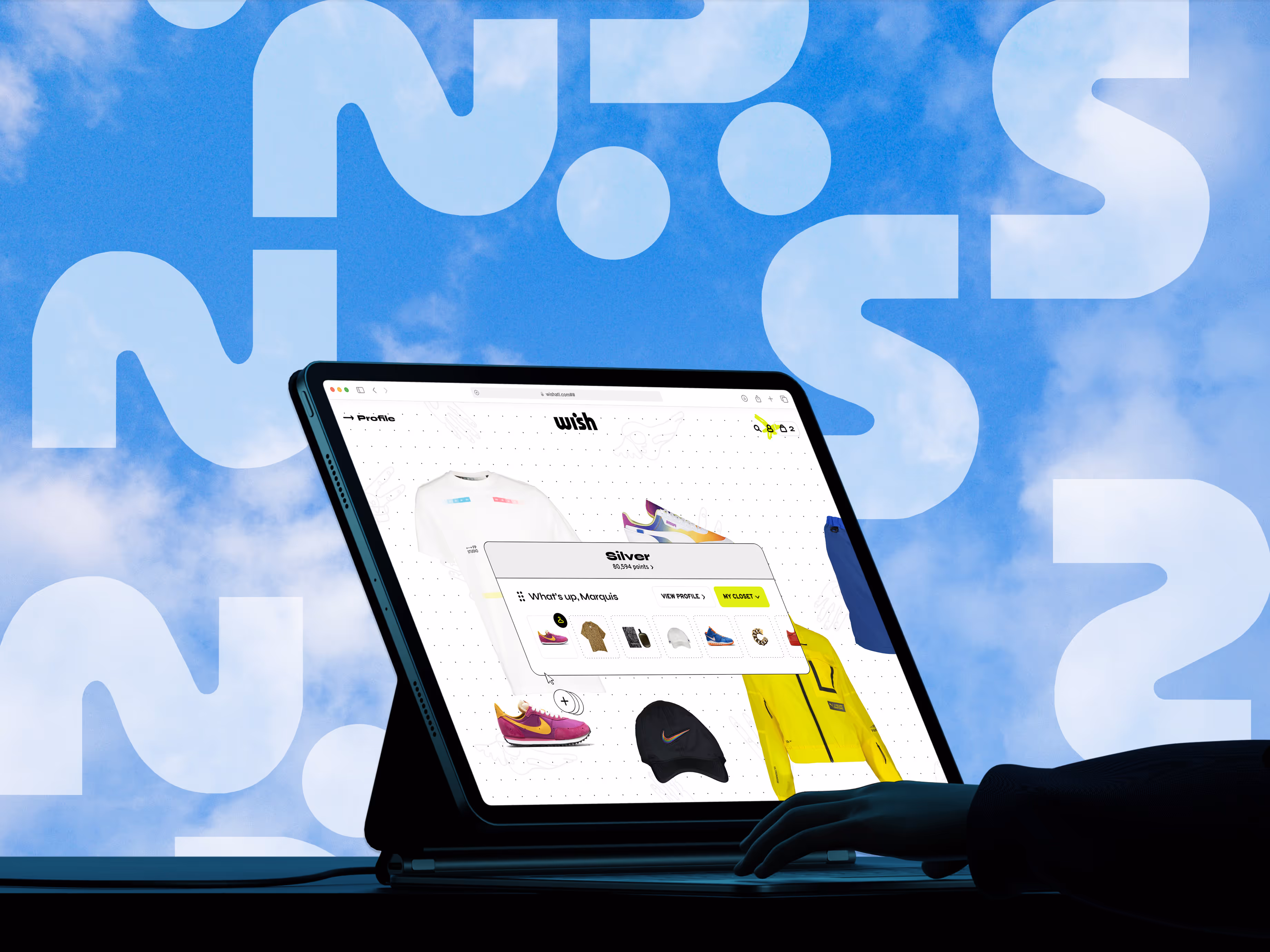 E-commerce fashion dashboard on a tablet screen with a modern interface showing sneakers, t-shirts, and accessories under a user profile named "Marquis." The background features a vibrant sky with large question marks, symbolizing interactive shopping experience and personalized product discovery.