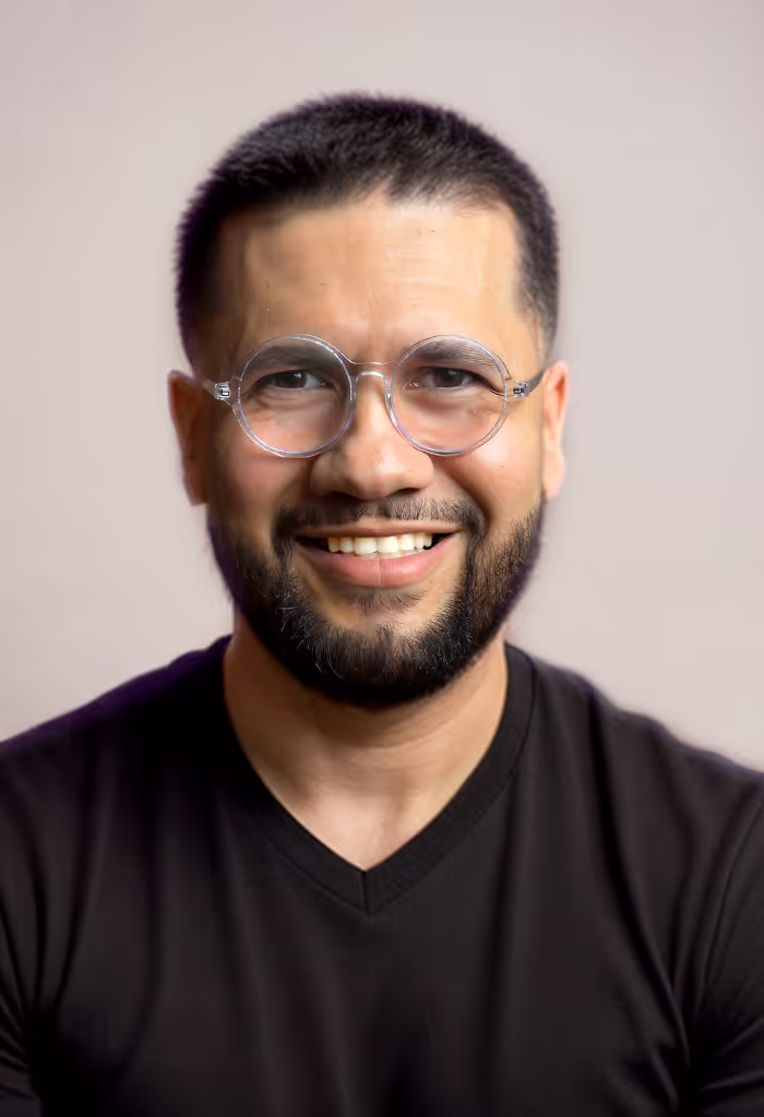 A headshot of Jesse Mercado smiling
