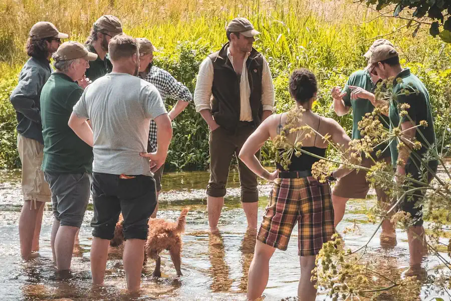 The Greenshank team standing in the River Piddle, Dorset