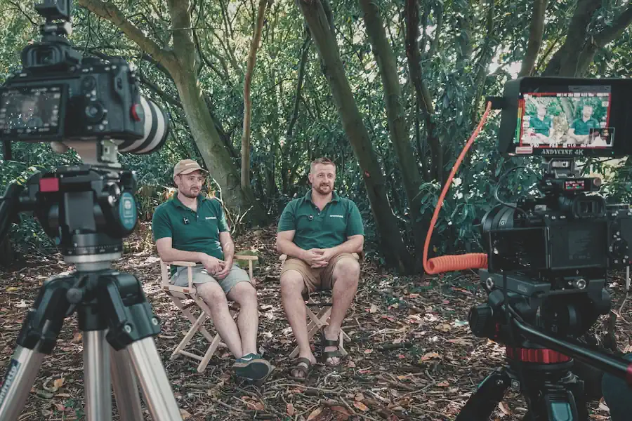 Dr Gabriel Connor-Streich and Kim Connor-Streich being filmed for interview in woodland