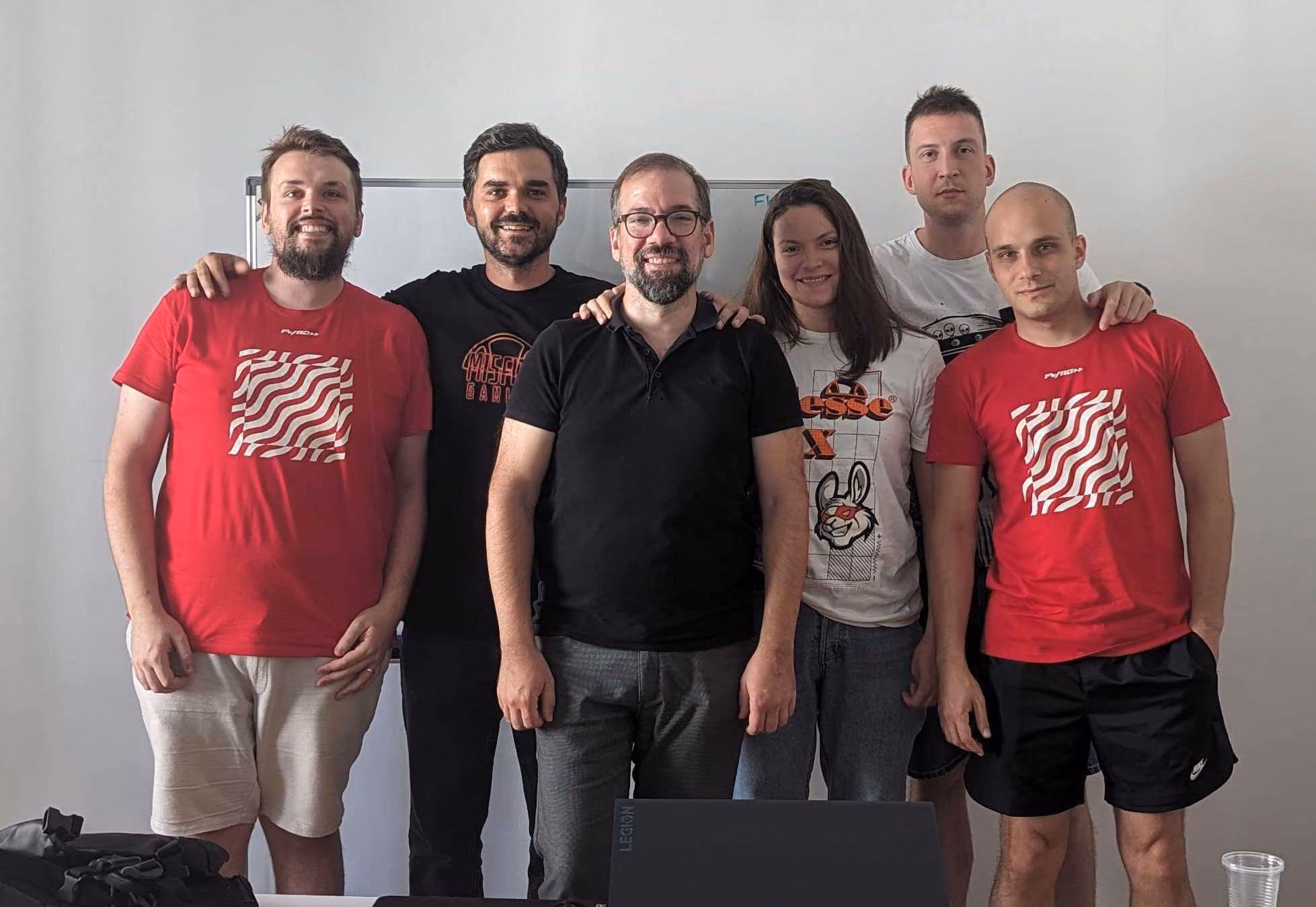 Group photo of the FWRD Digital & Product creative team standing together in their office workspace.