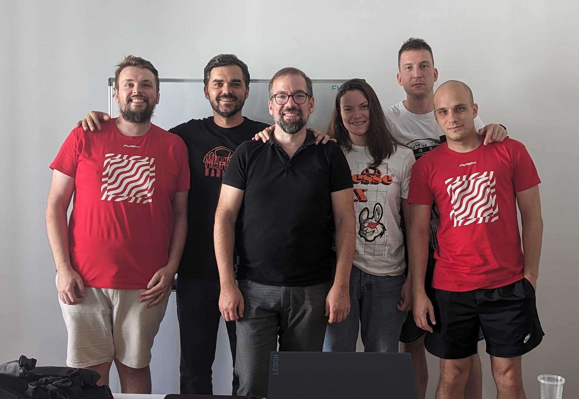 Group photo of the FWRD Digital & Product creative team standing together in their office workspace.