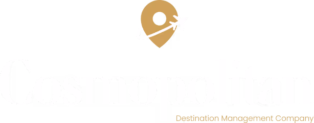 Cosmopolitan Destination Management Company logo with gold location pin and airplane icon above serif wordmark.
