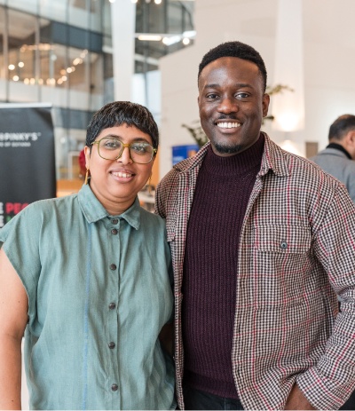 Two people hugging and smiling