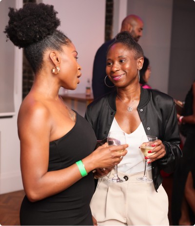 Two women talking while having a drink