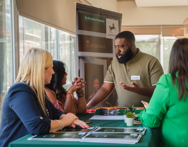 A man from Lloys Bank talking to a group of poeple
