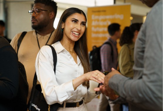 woman shaking the hand of another
