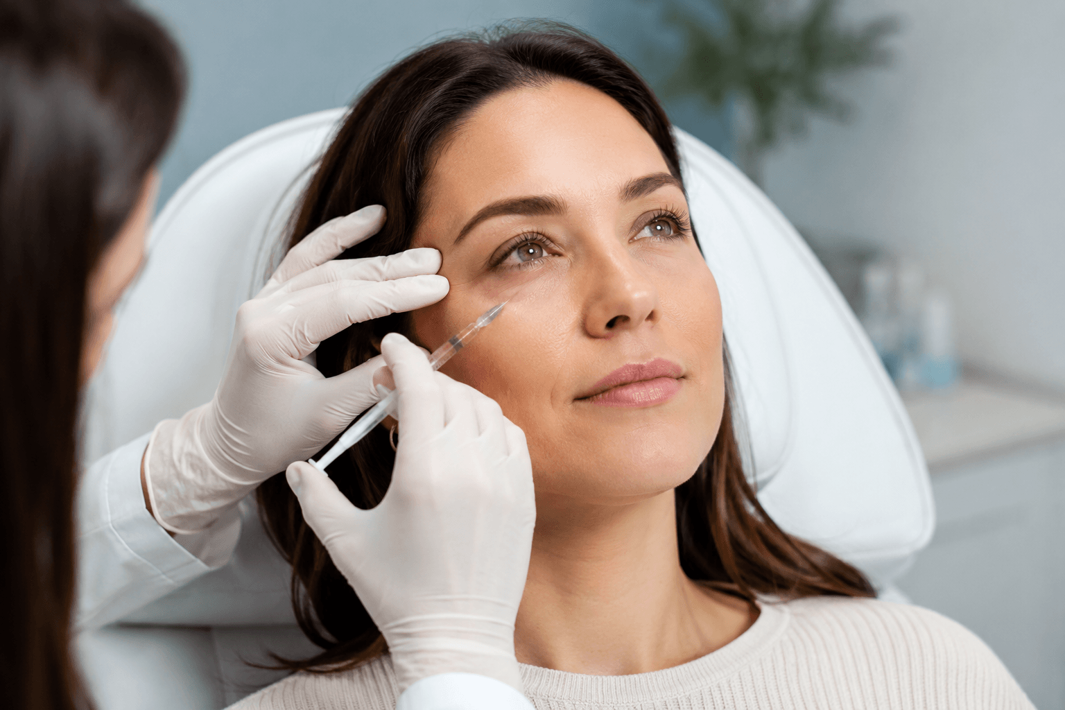 Patient receiving under-eye dermal fillers in McMurray, Pennsylvania to treat hollow and tired-looking eyes