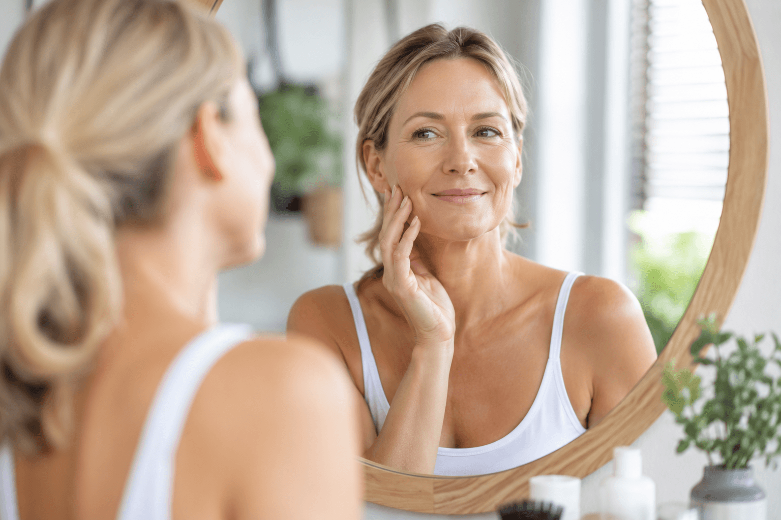 Woman smiling naturally after facial volume restoration consultation for Sculptra in McMurray, Pennsylvania