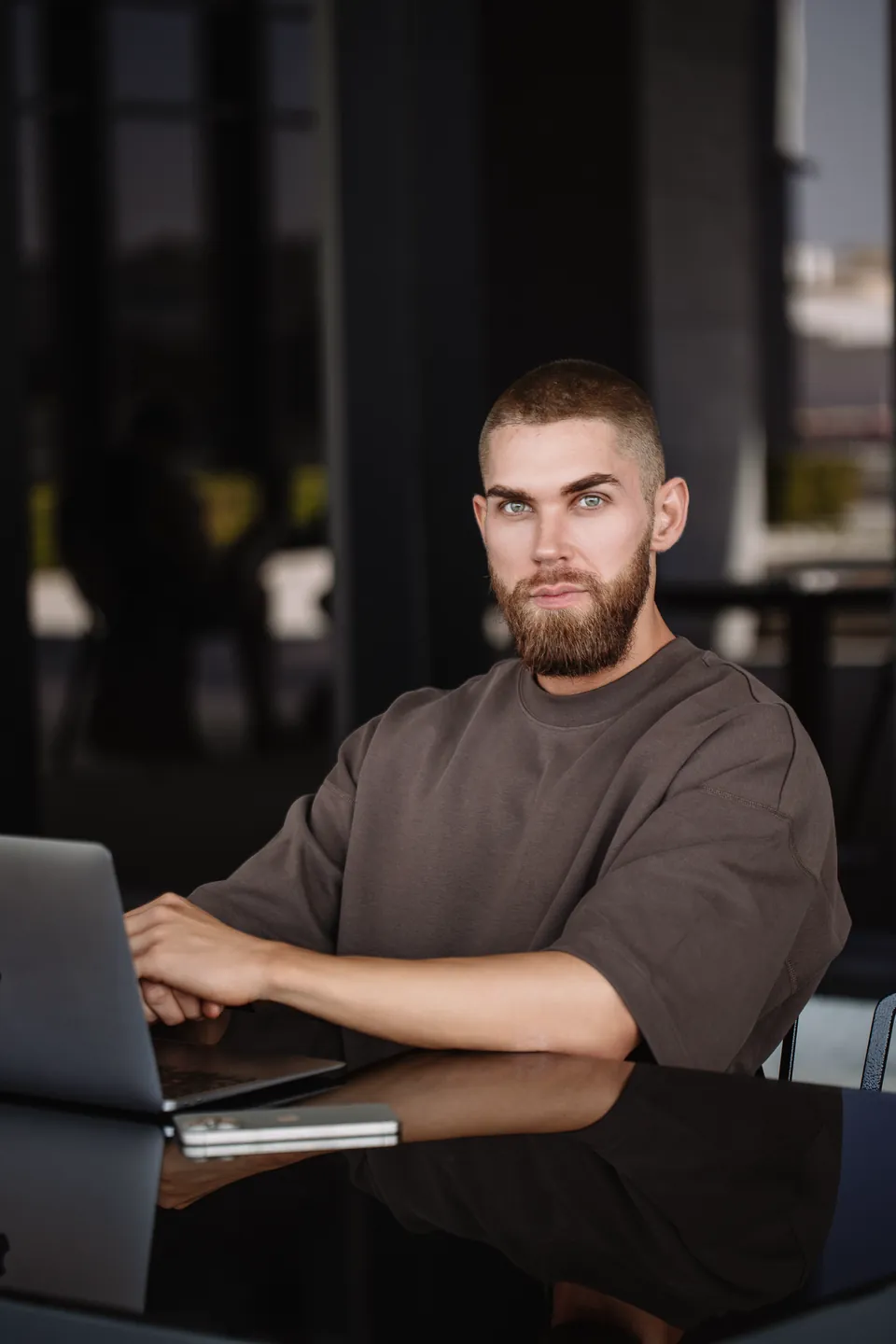 Bohdan Drobot reviewing work at his laptop