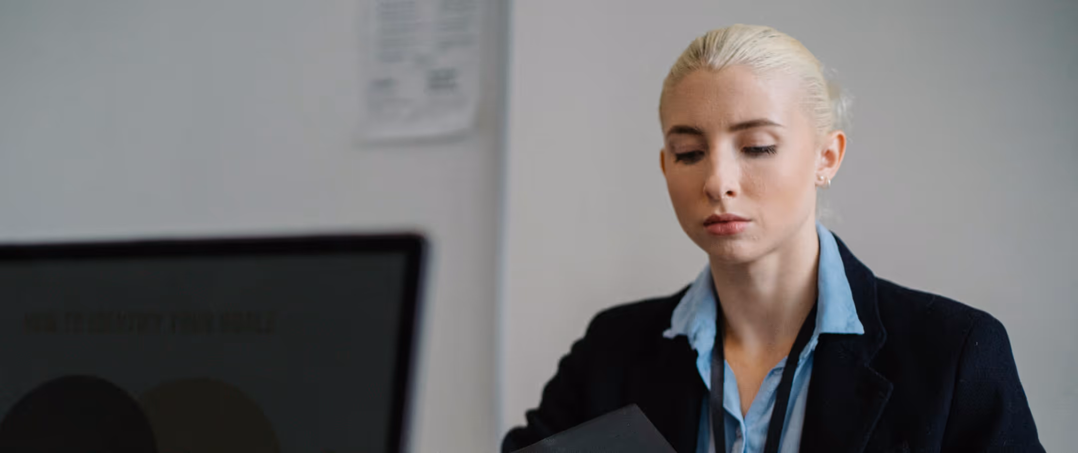 Professional reviewing assessment material in an office