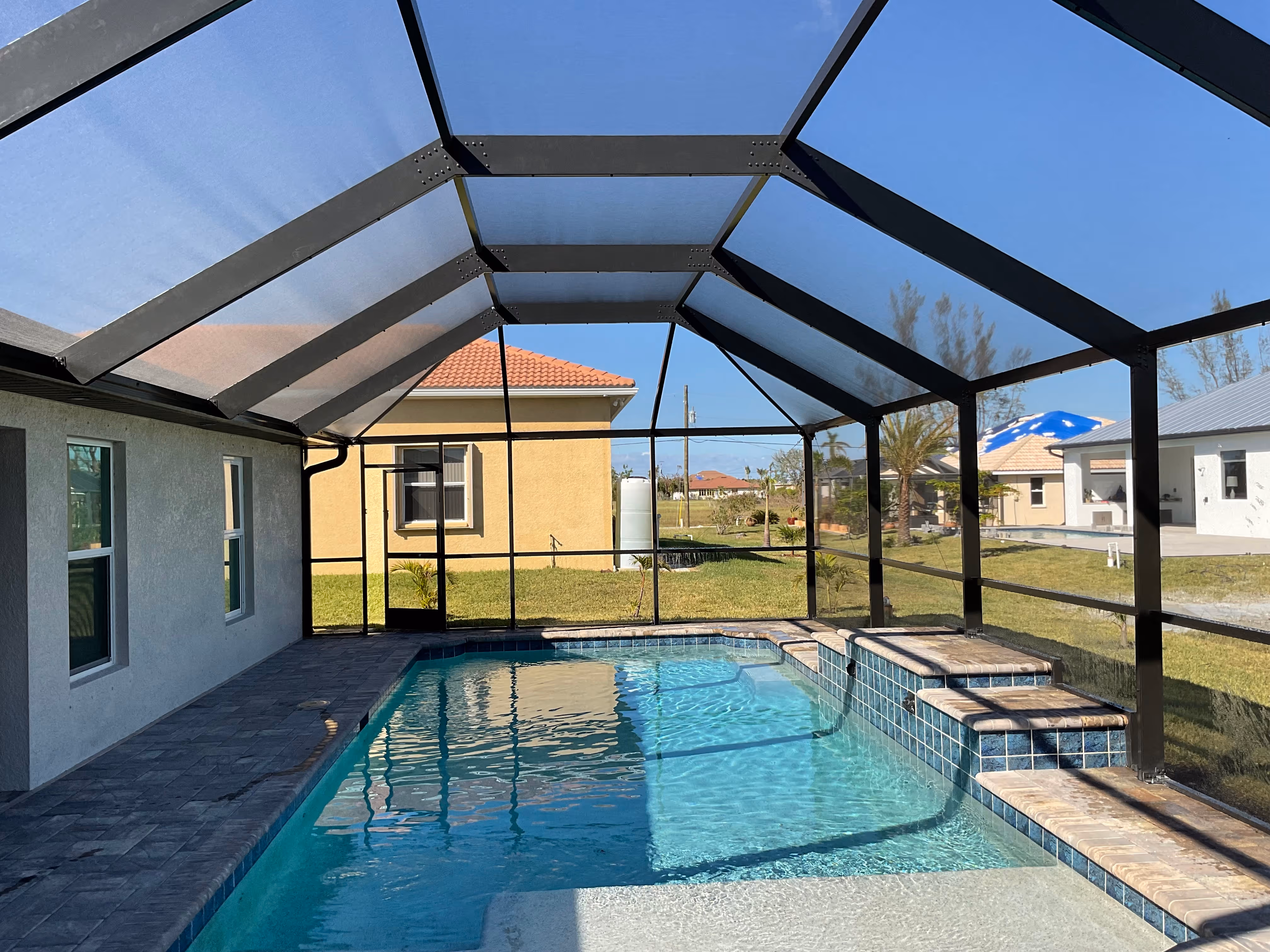 Custom aluminum pool cage installation South Florida — AB Aluminum & Screens