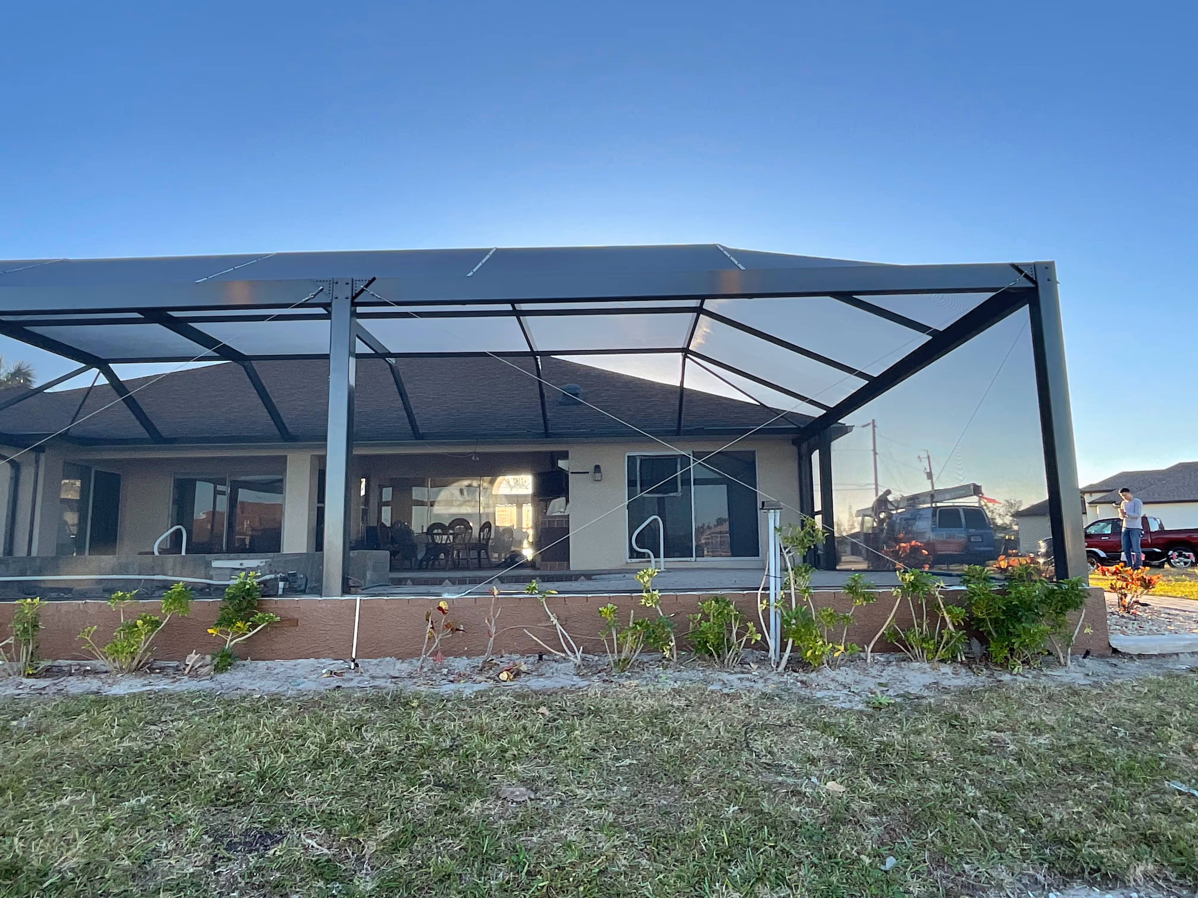 White aluminum pool enclosure frame installation — AB Aluminum & Screens