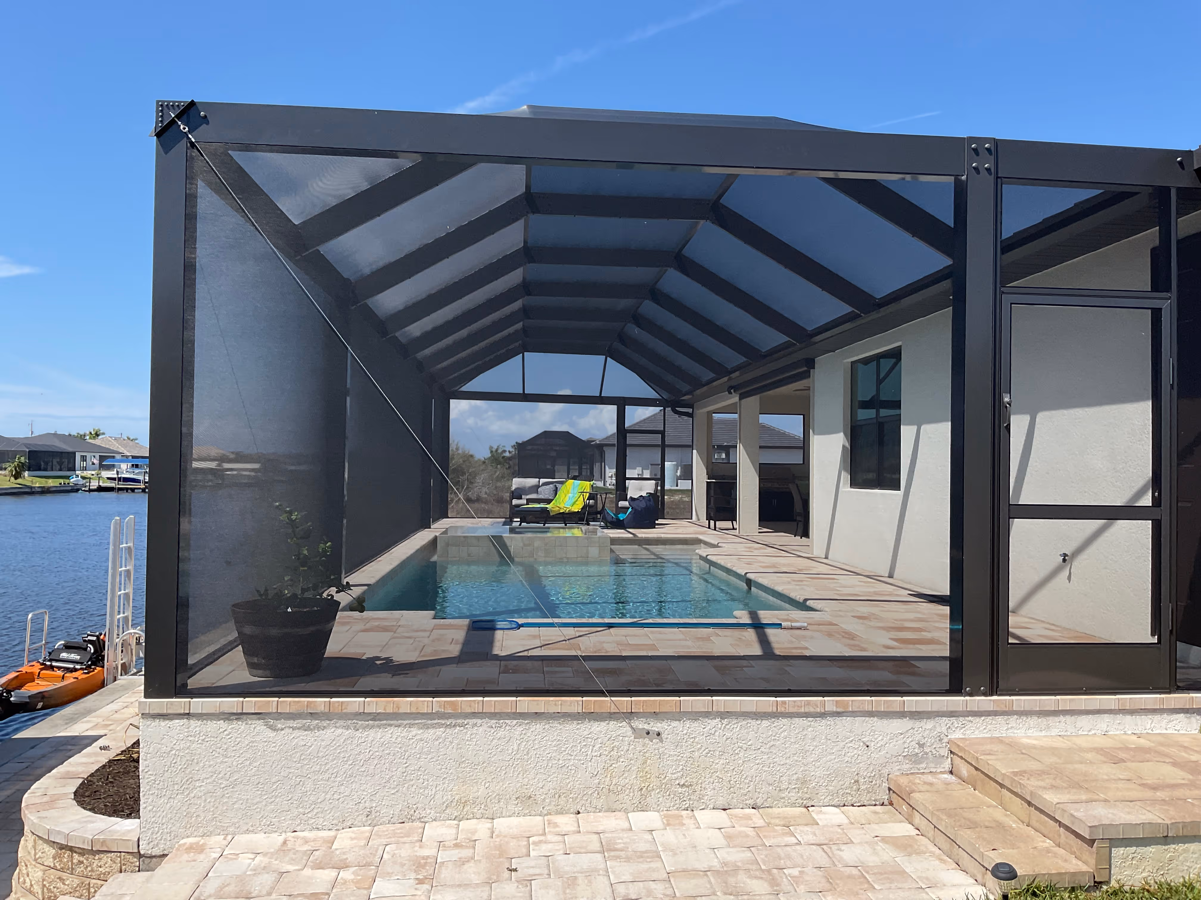 Screened pool enclosure with patio area South Florida — AB Aluminum & Screens