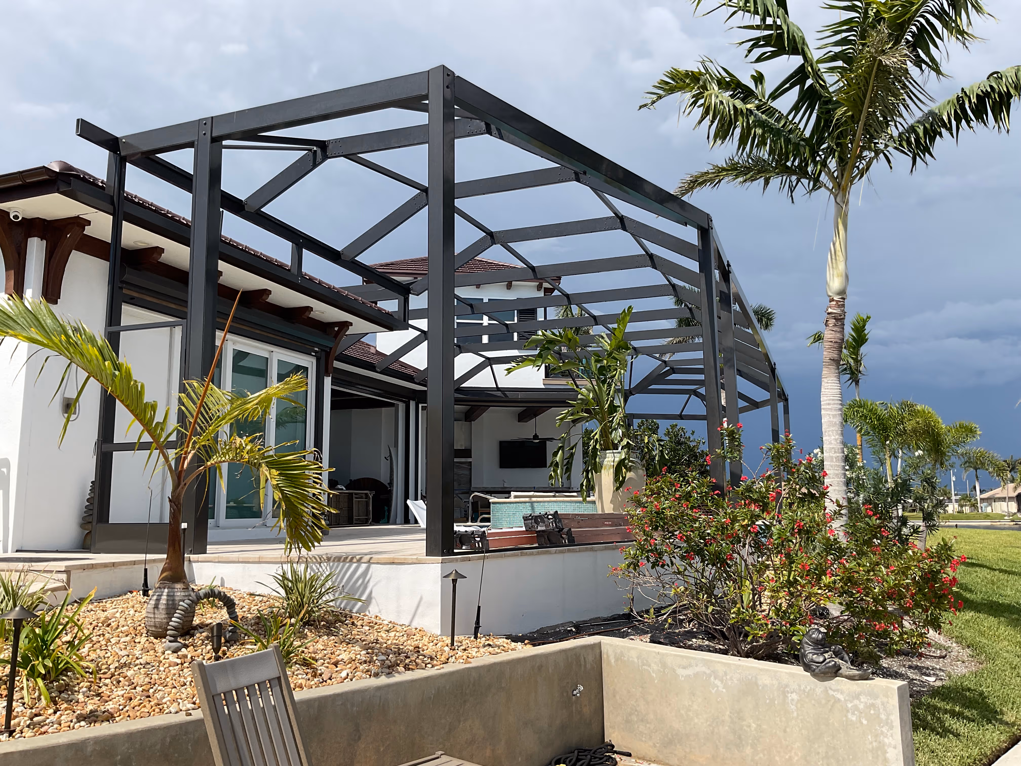 Completed pool cage installation residential home Miami — AB Aluminum & Screens