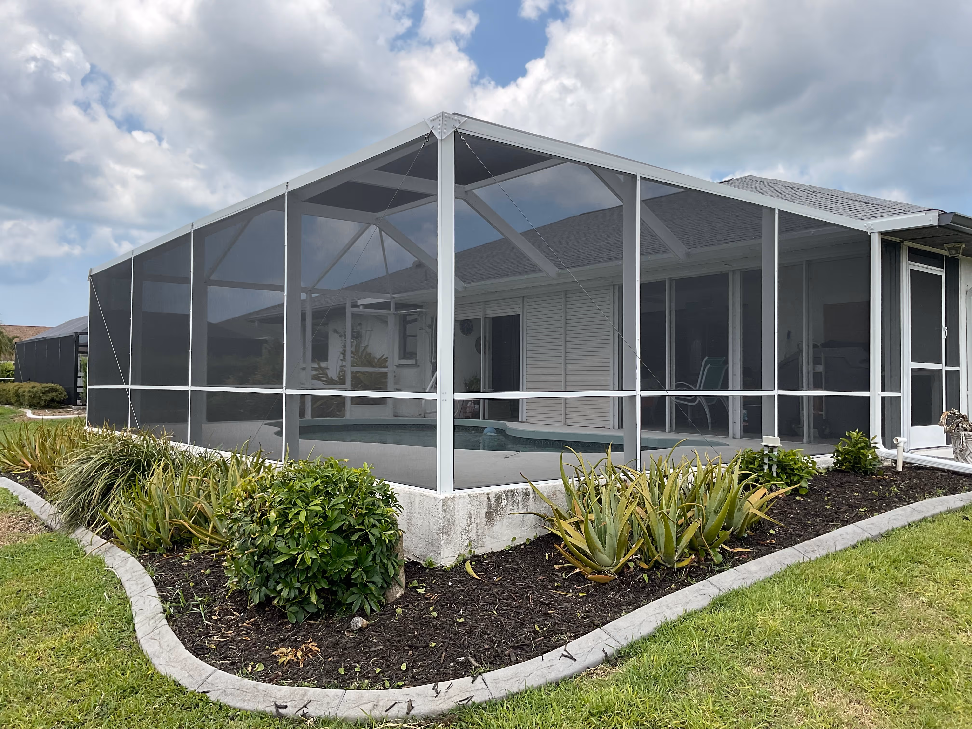 Pool screen cage aluminum structure South Florida residential — AB Aluminum & Screens