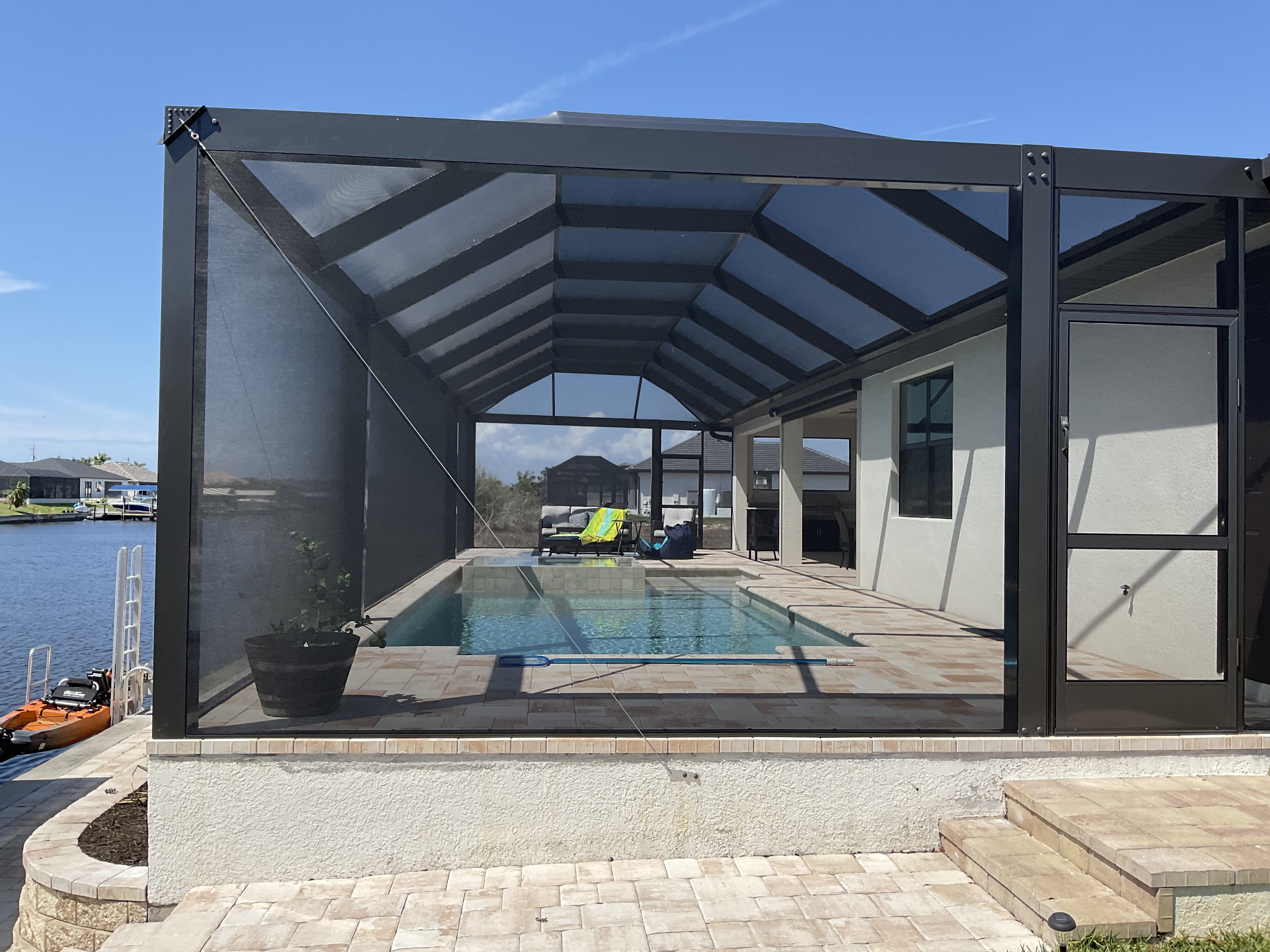 Screened pool enclosure with patio area South Florida — AB Aluminum & Screens