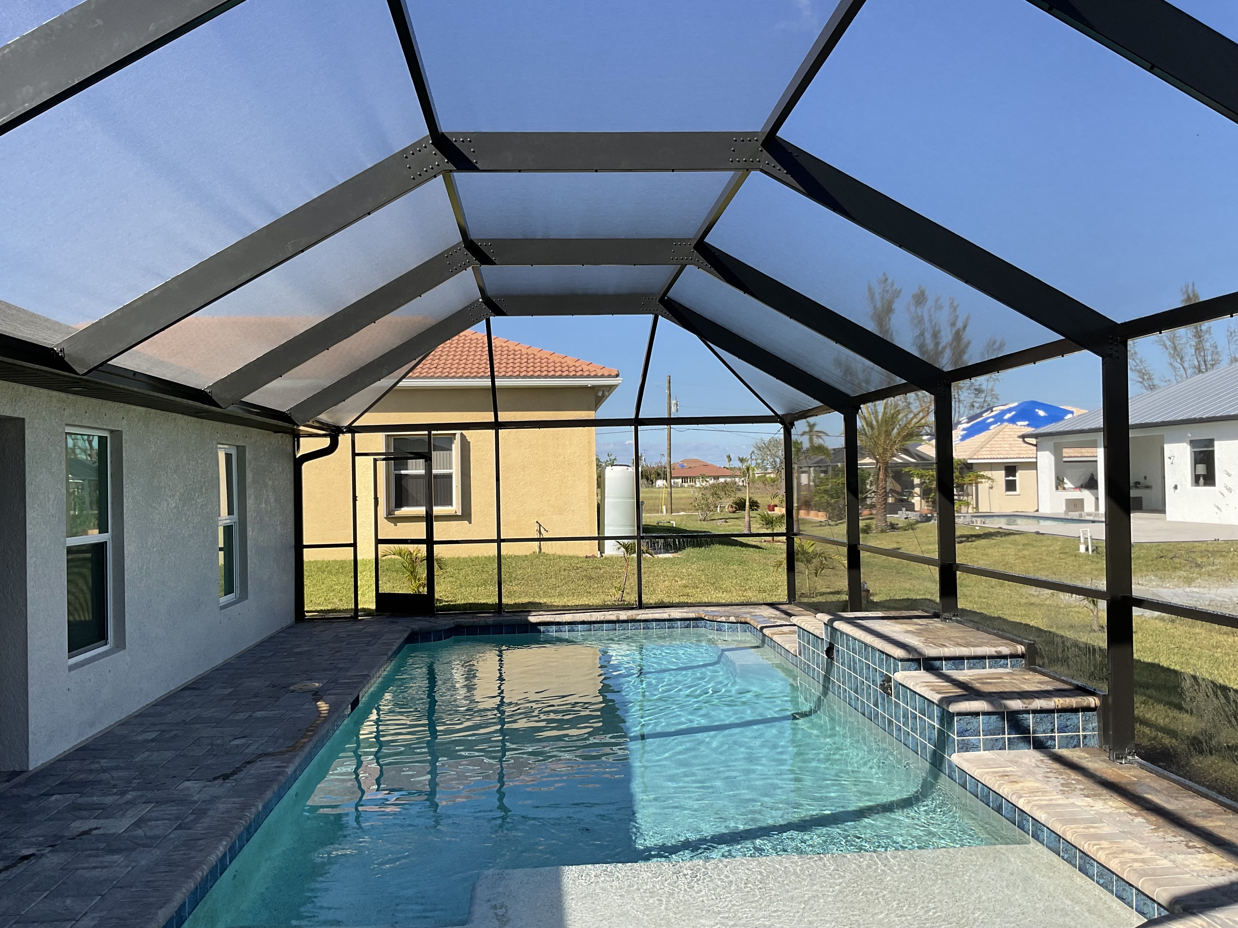 Custom aluminum pool cage installation South Florida — AB Aluminum & Screens