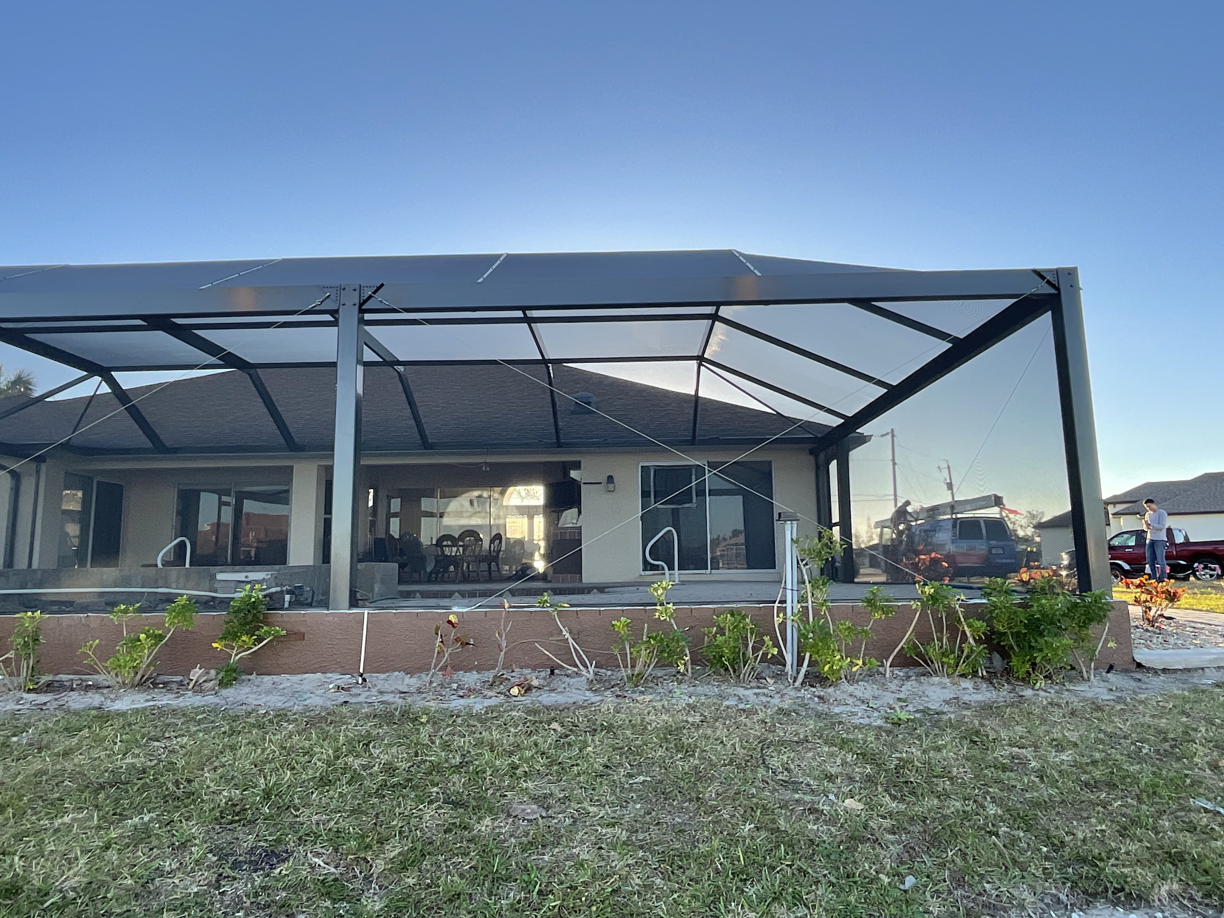White aluminum pool enclosure frame installation — AB Aluminum & Screens