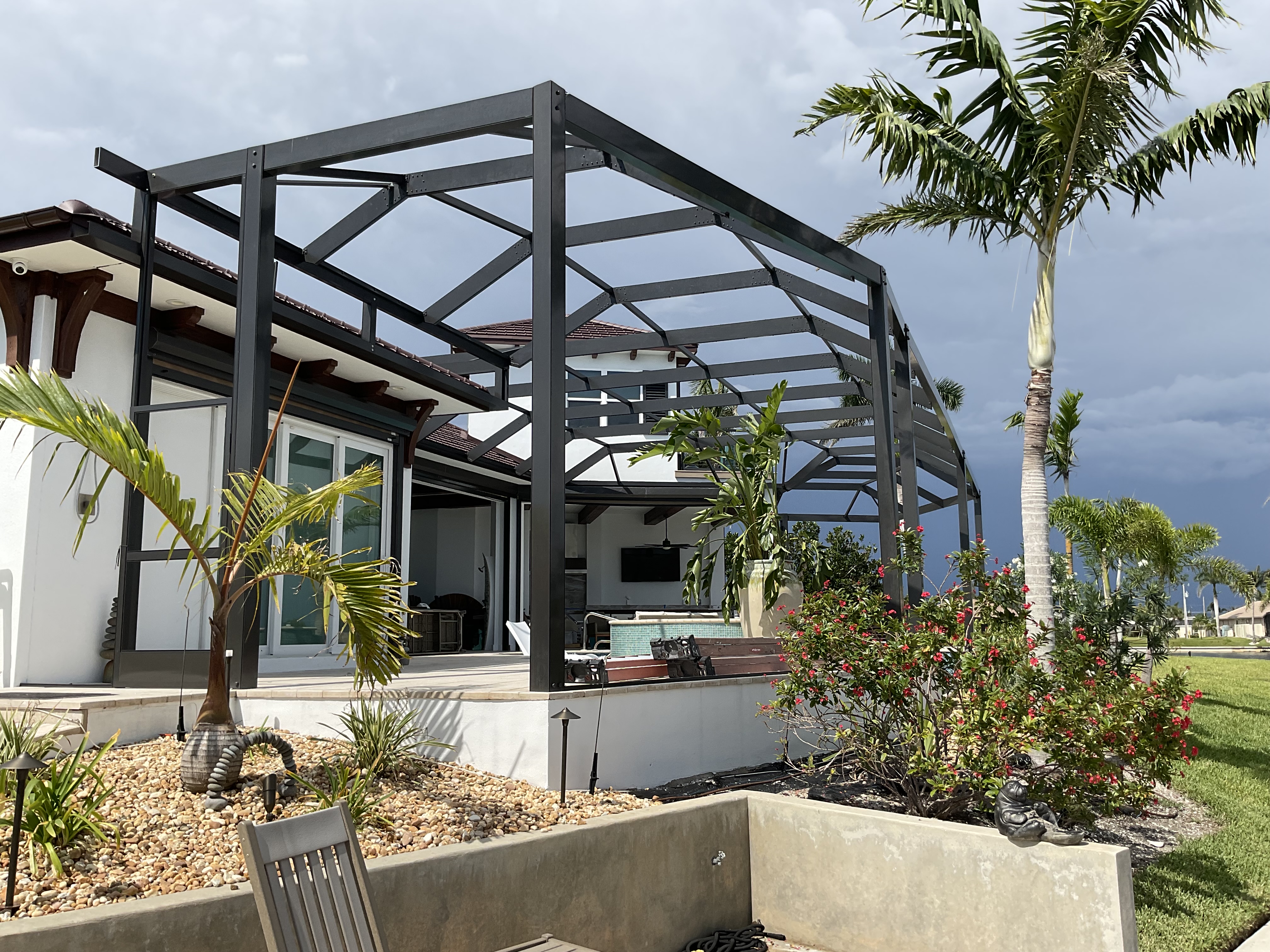 Completed pool cage installation residential home Miami — AB Aluminum & Screens