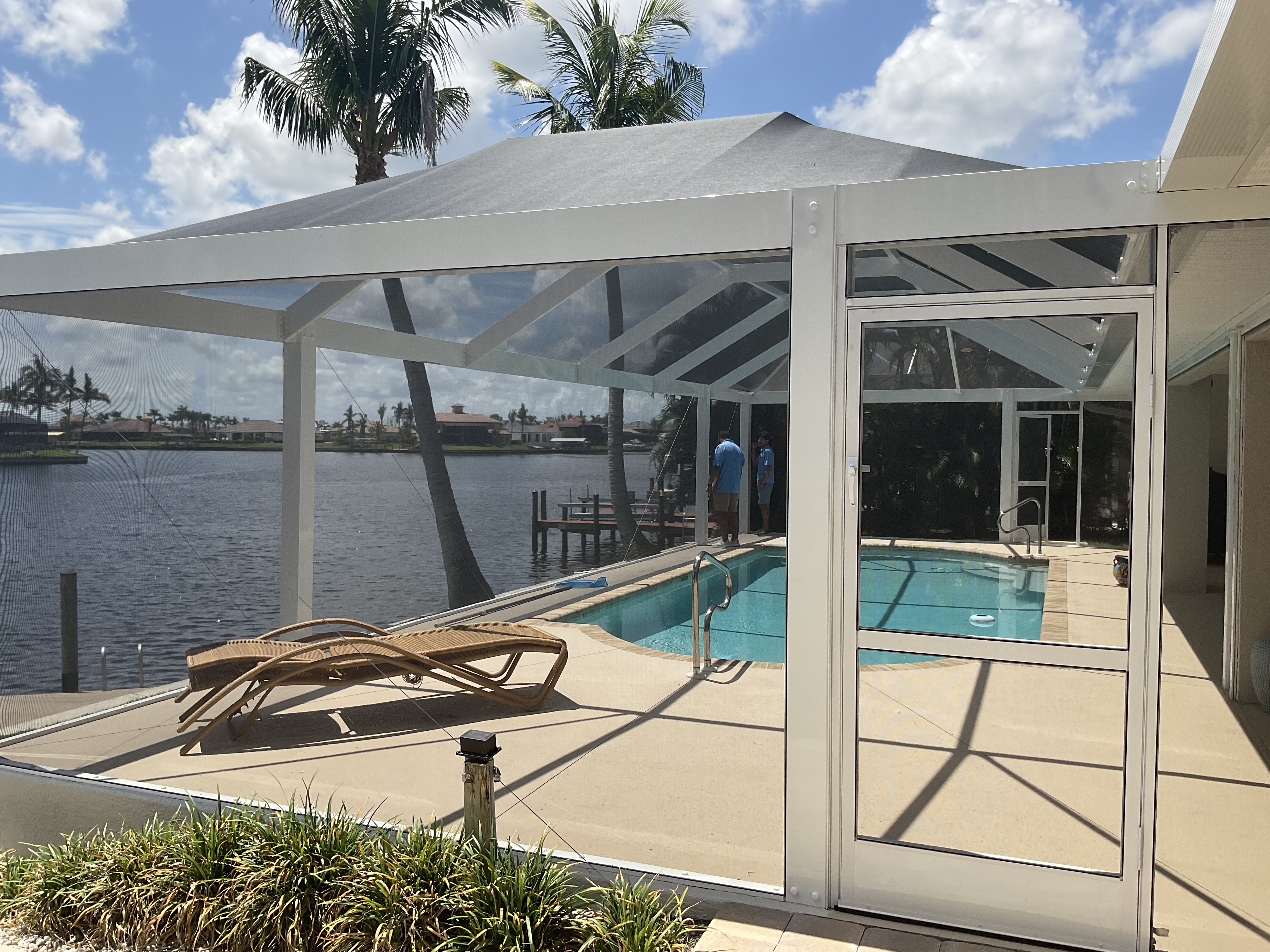 Pool cage installation with screened patio extension — AB Aluminum & Screens South Florida