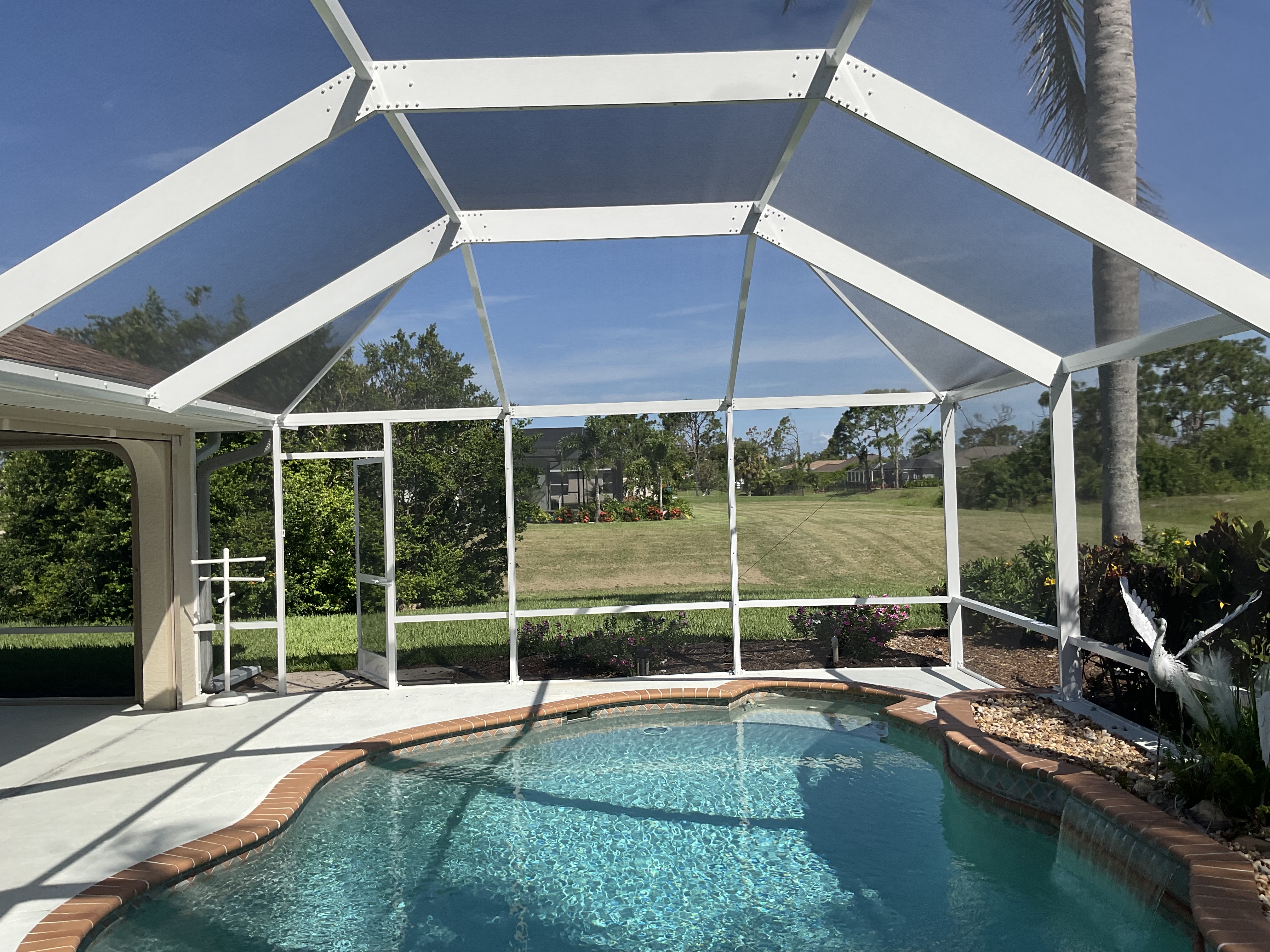 Pool screen enclosure exterior view South Florida home — AB Aluminum & Screens
