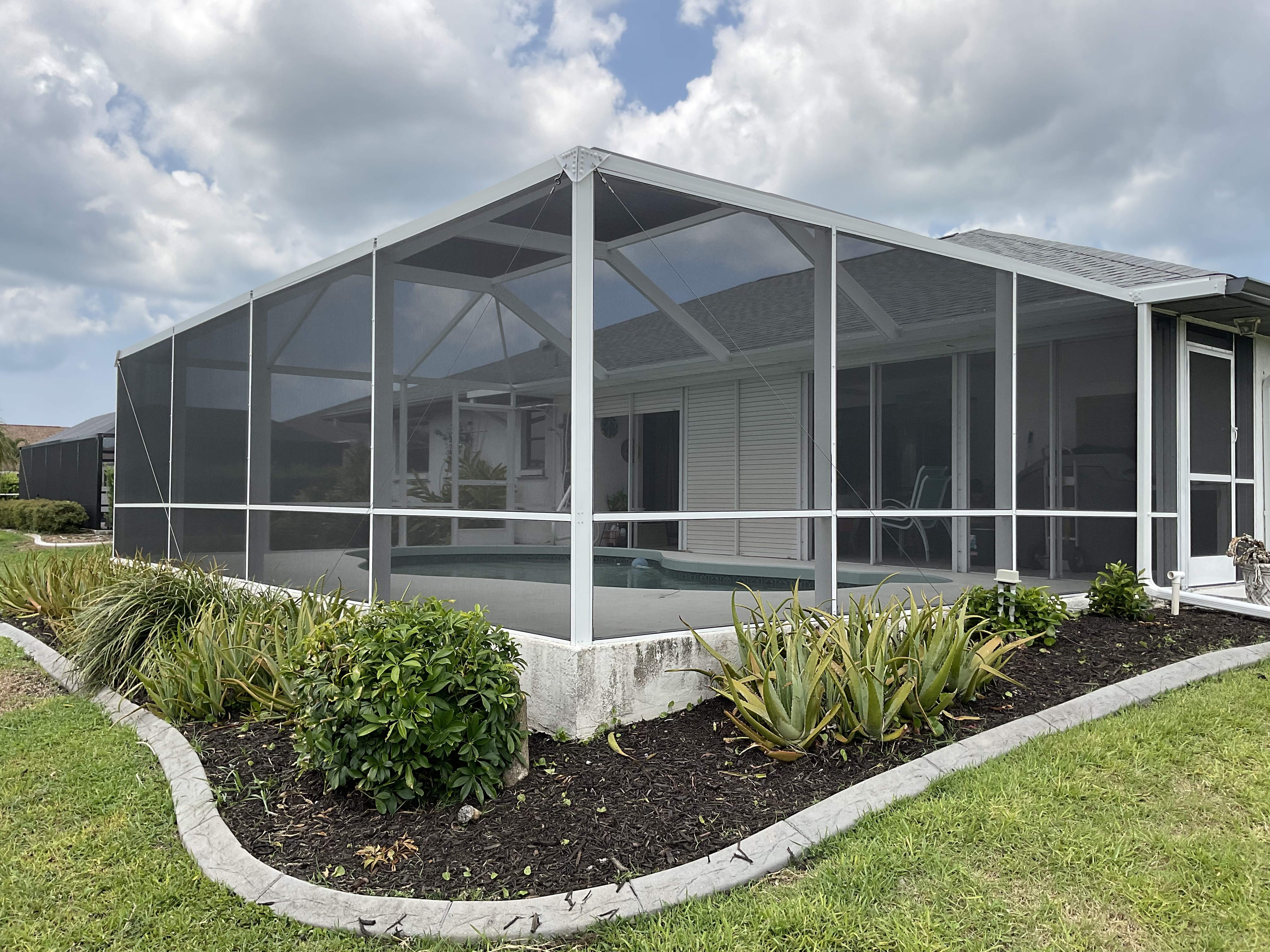 Pool screen cage aluminum structure South Florida residential — AB Aluminum & Screens