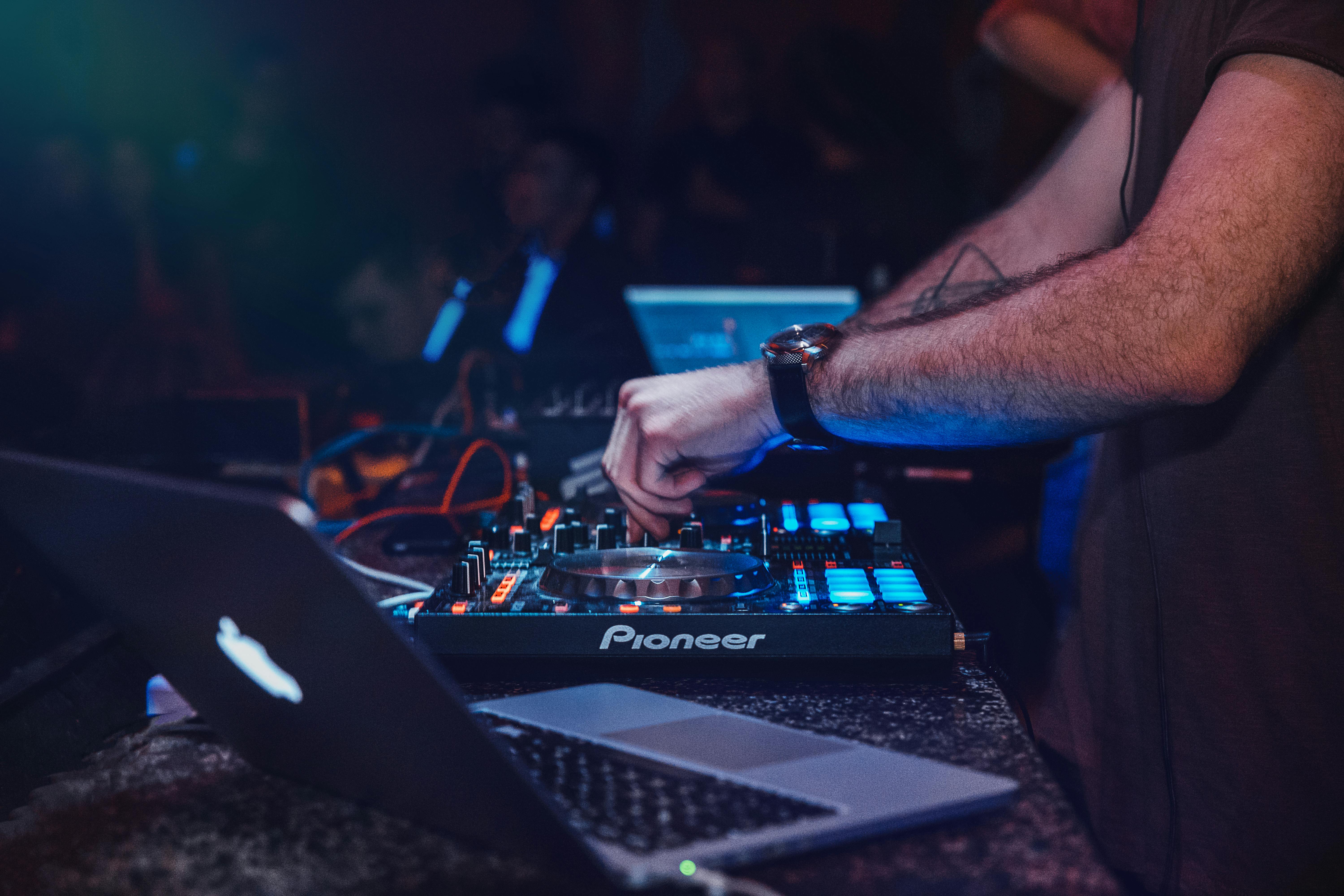 A Hip Hop DJ in action, demonstrating their importance to hip-hop culture.