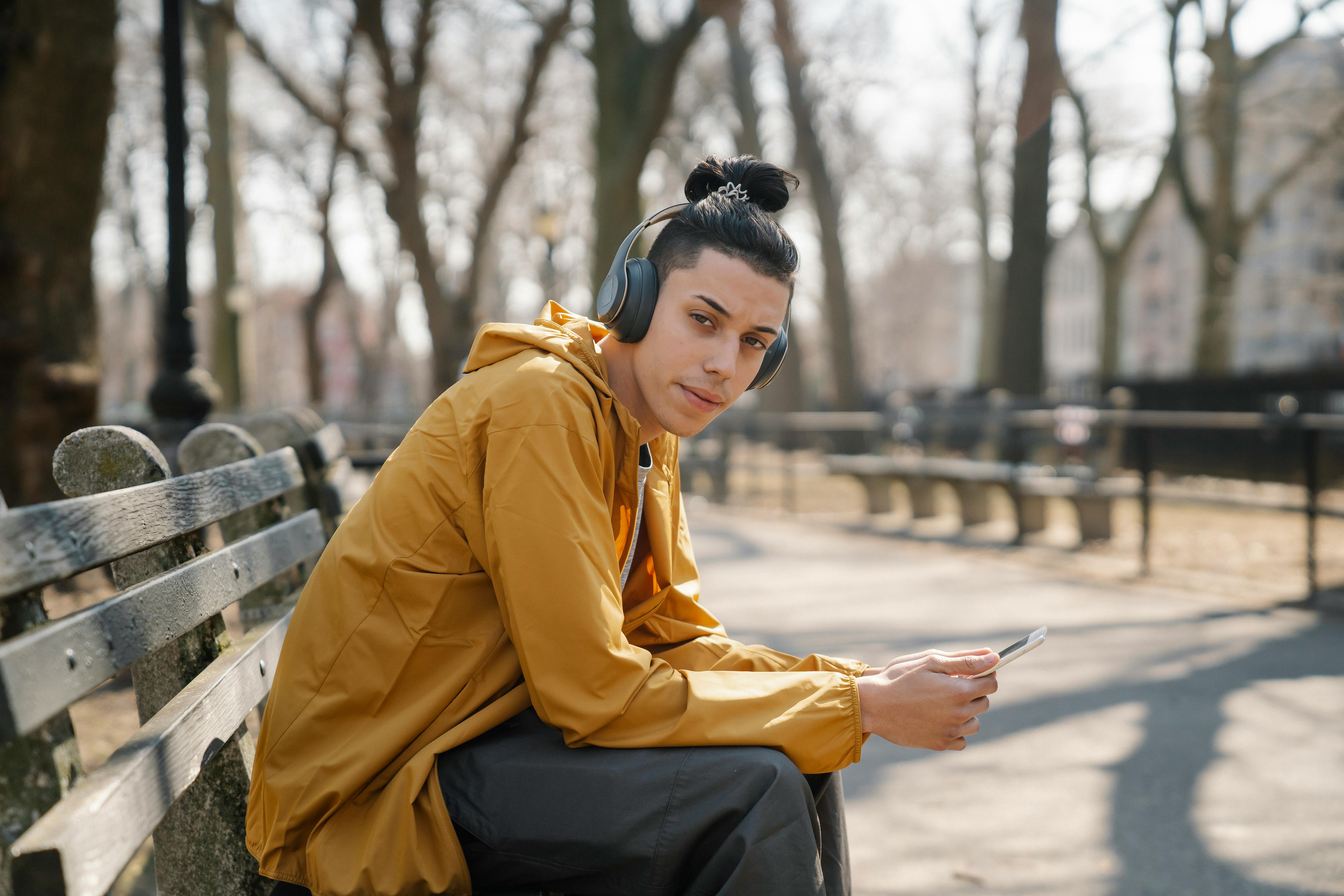 An artist listening to music on the go, showcasing the importance of mobile music generation.