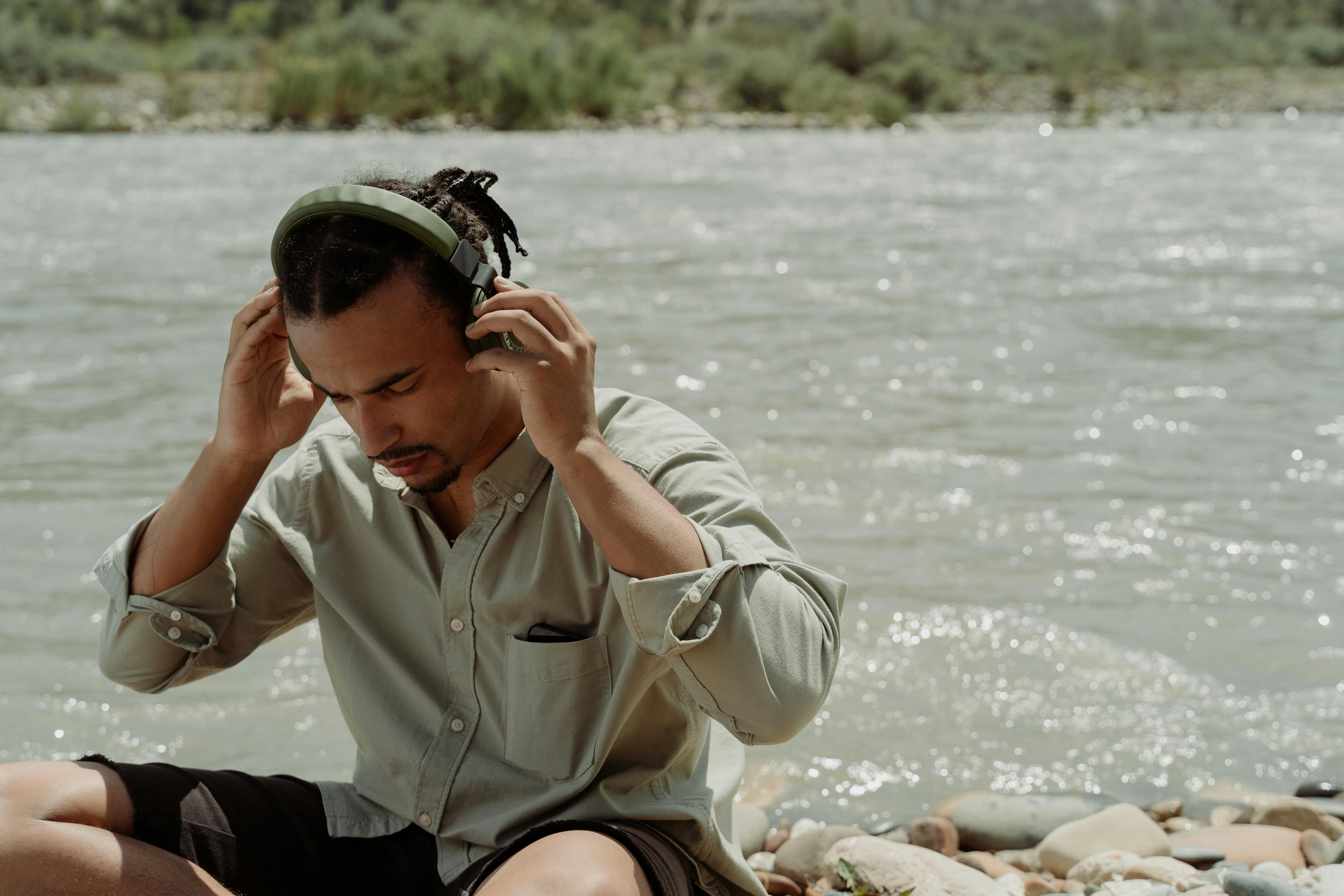 A person listening to music while meditating, signifying the importance of the former to the latter.