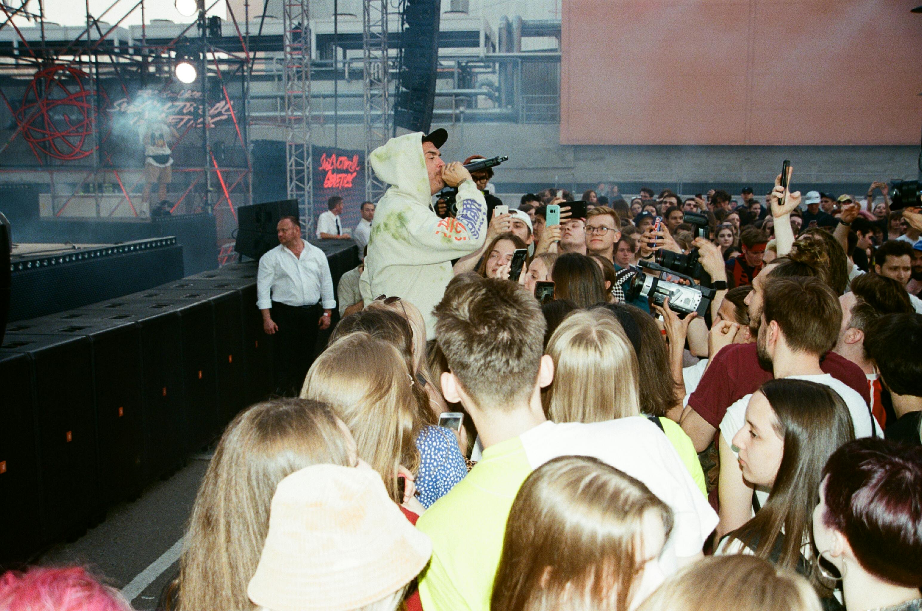 A hip-hop artist performing at a concert, showcasing hip-hop's massive reach in today's world.