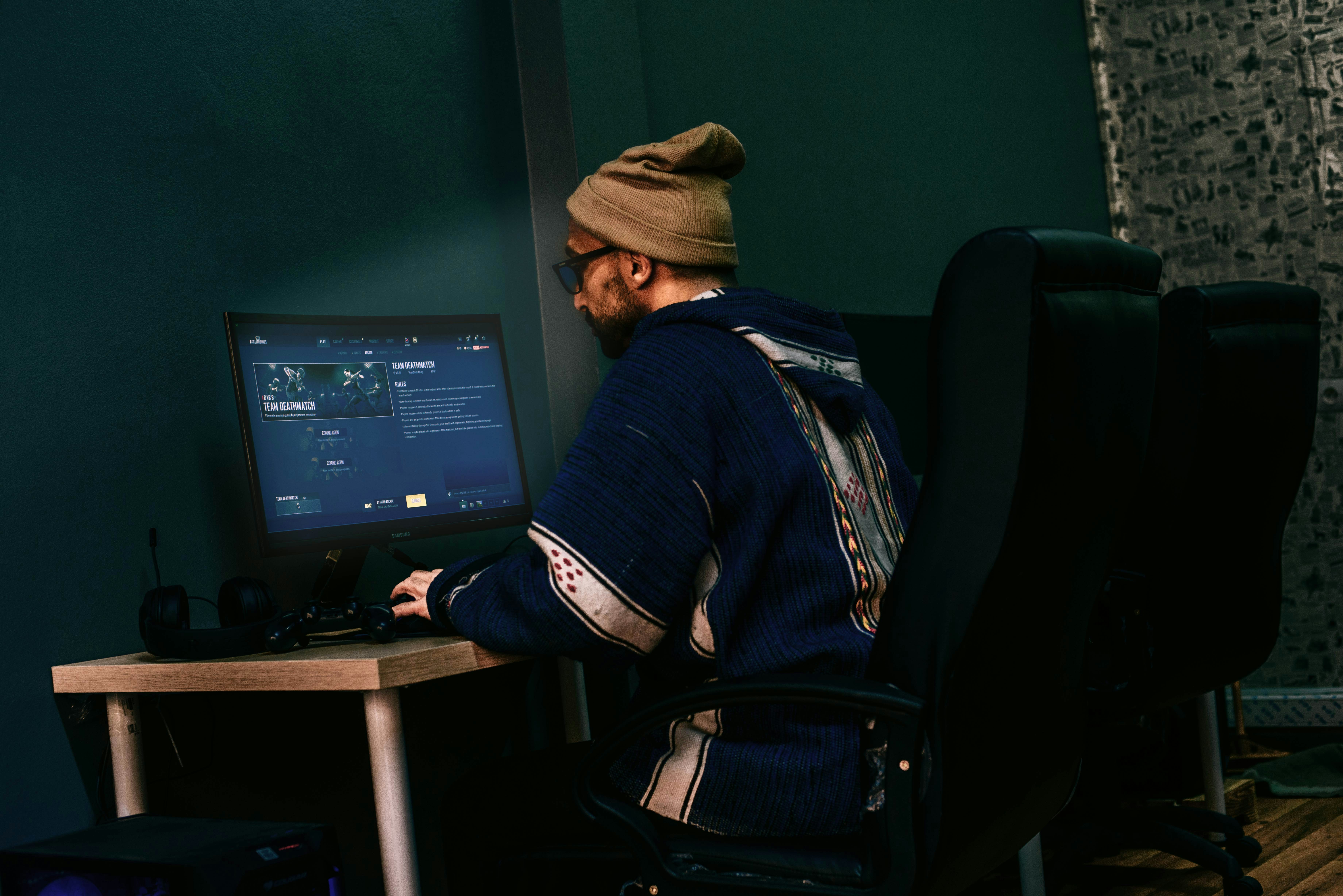 Producer at a DAW with monitors and interface.