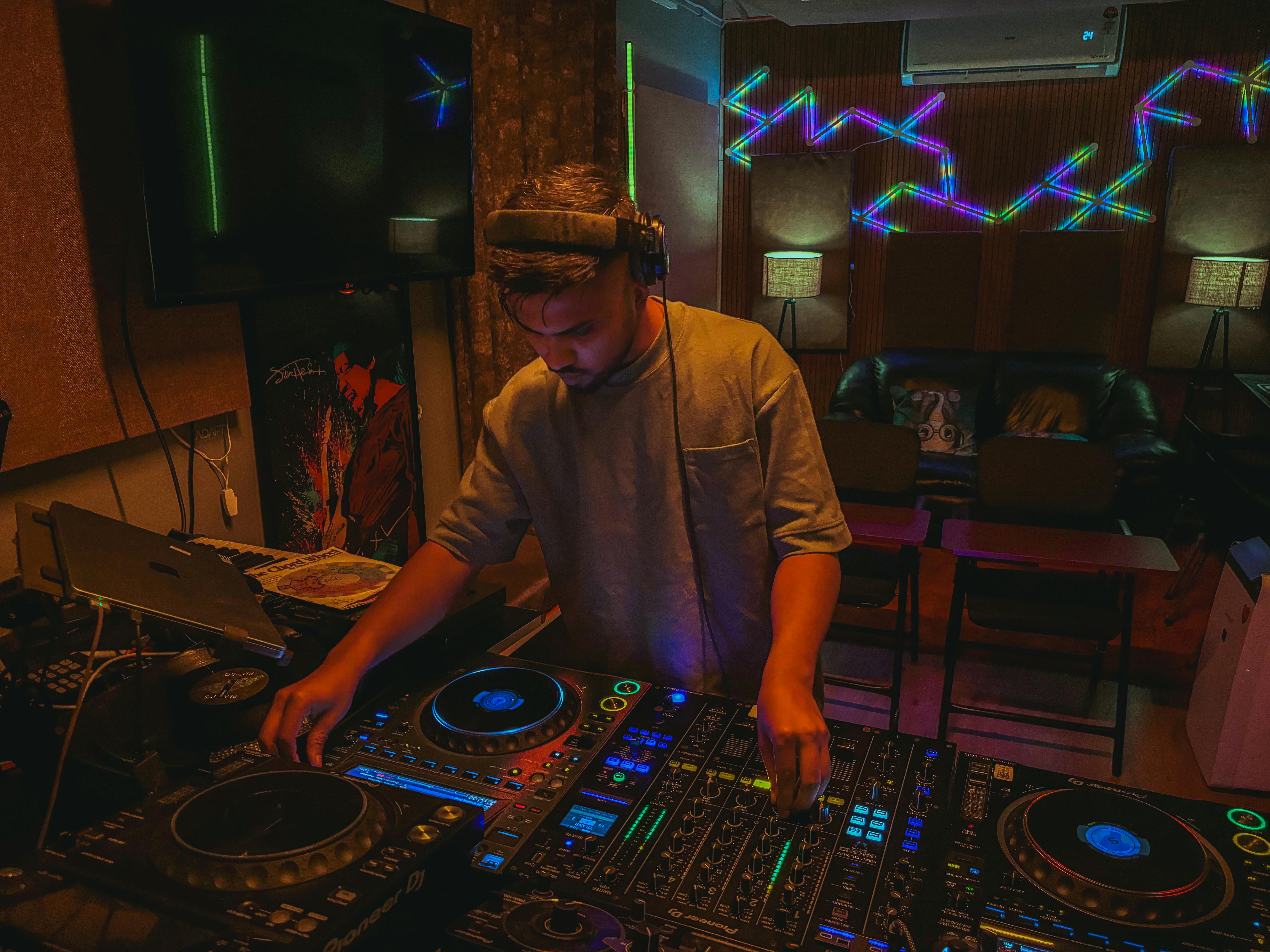 An artist working on a DJ deck, representing the importance of sound experimentation.