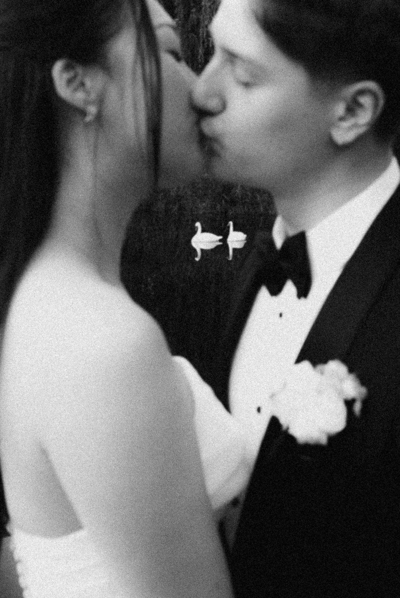 Black and white close-up of a bride and groom kissing at a Windrift Hall wedding in the Hudson Valley