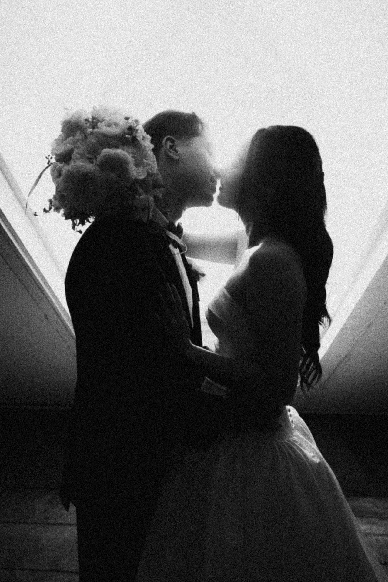 Black and white photograph of a couple holding each other at a Windrift Hall wedding