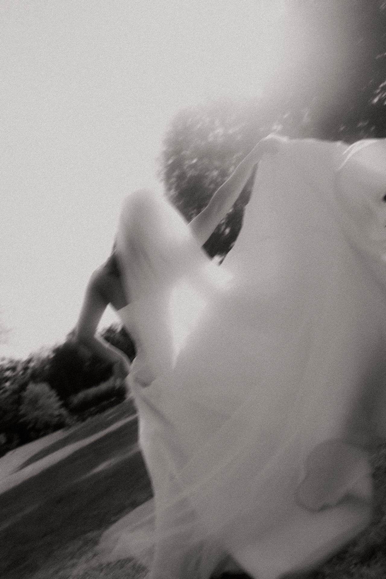 Black and white frame of a bride's veil caught in motion at an Old Mill Guesthouse wedding