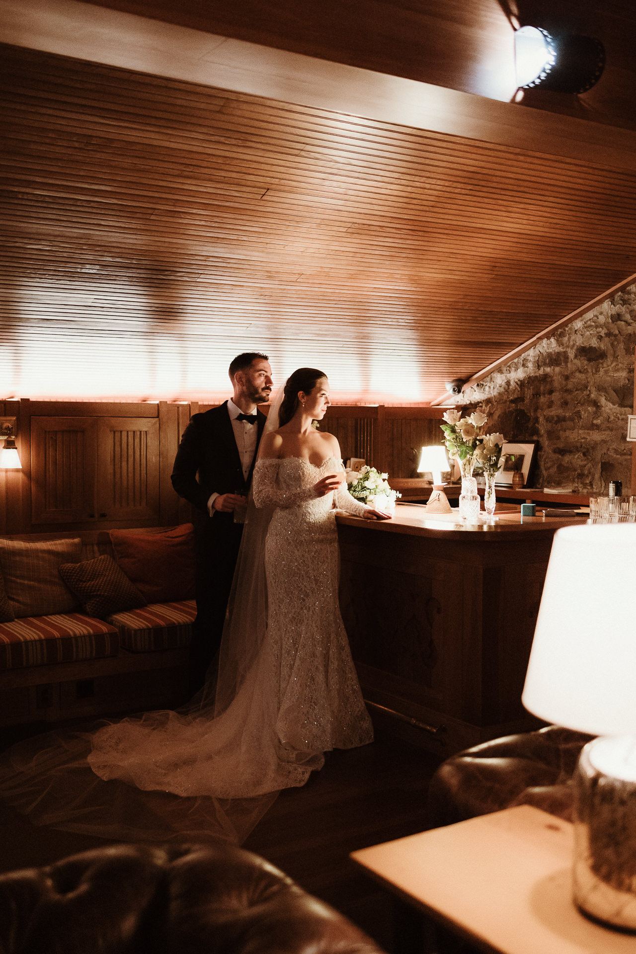 Couple standing together in the wood-panelled lounge at a Deer Mountain Inn wedding in the Catskills