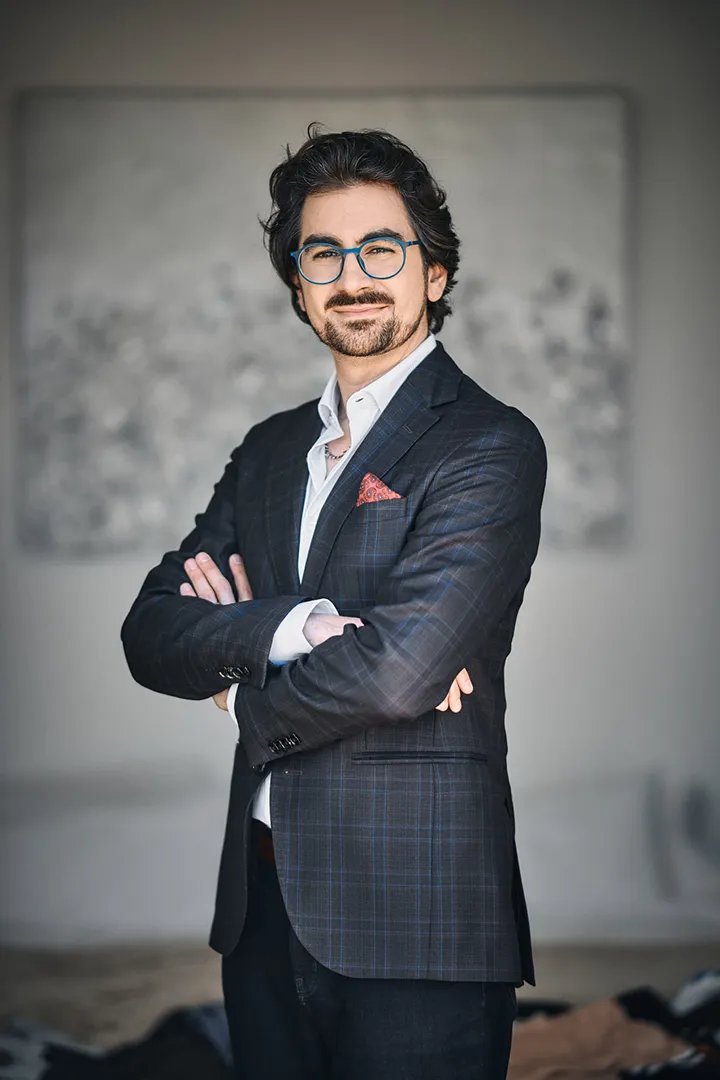 Brian Miller wearing suit and eyeglass