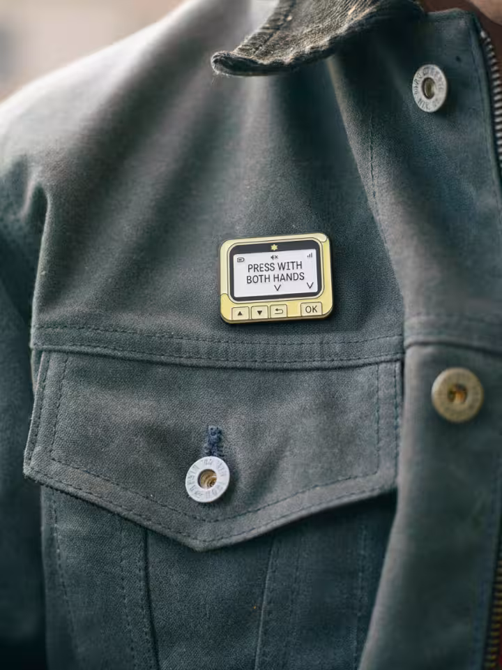 Angry Zionist Gold Pin Pager on Jacket 
